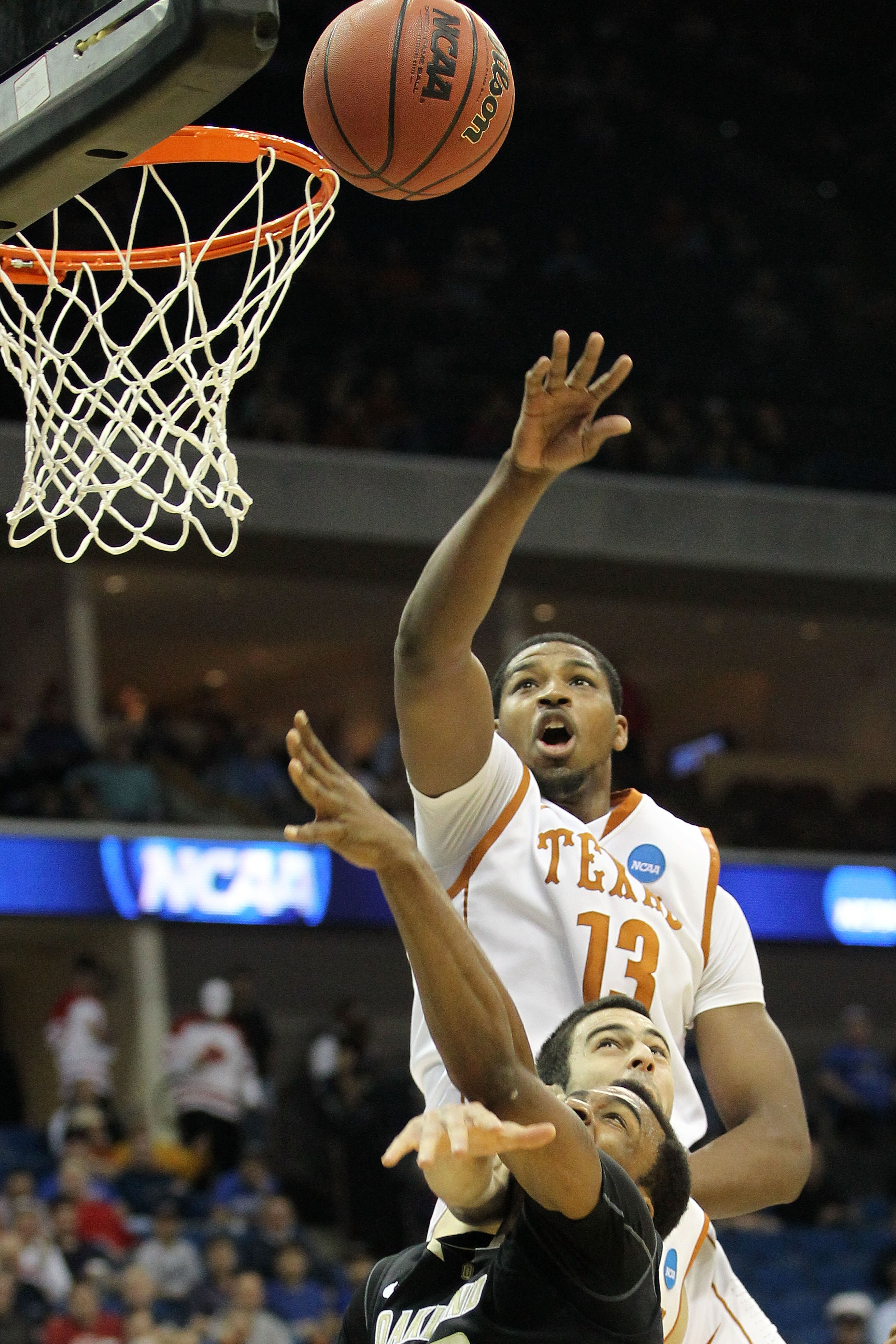TULSA, OK - MARCH 18:  Tristan Thompson #13 of the Texas Longhorns blocks a shot by Reggie Hamilton #23 of the Oakland Golden Grizzlies during the second round game of the 2011 NCAA men's basketball tournament at BOK Center on March 18, 2011 in Tulsa, Okl