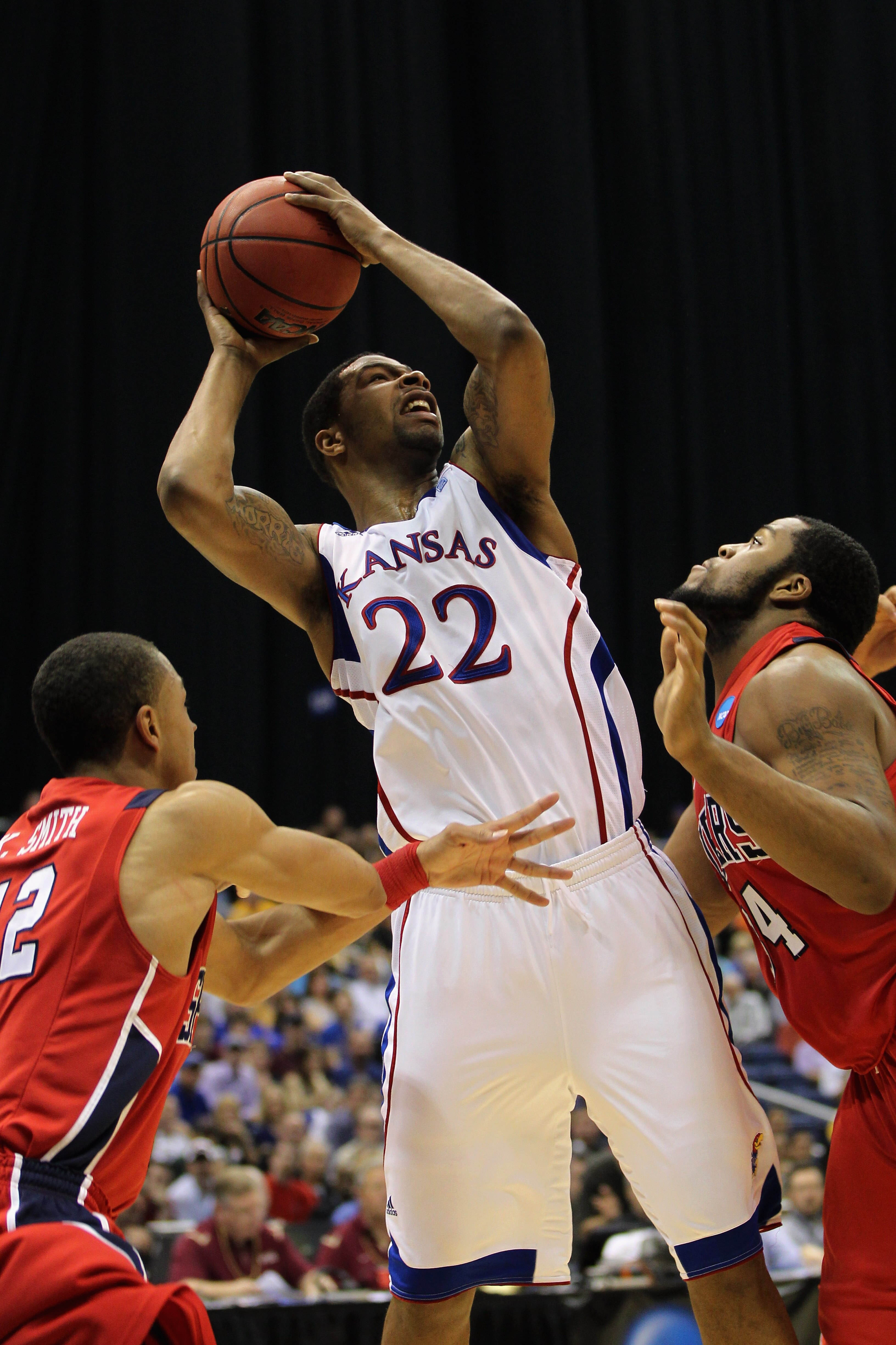 SAN ANTONIO, TX - MARCH 25:  Marcus Morris #22 of the Kansas Jayhawks shoots against the Richmond Spiders during the southwest regional of the 2011 NCAA men's basketball tournament at the Alamodome on March 25, 2011 in San Antonio, Texas.  (Photo by Jamie