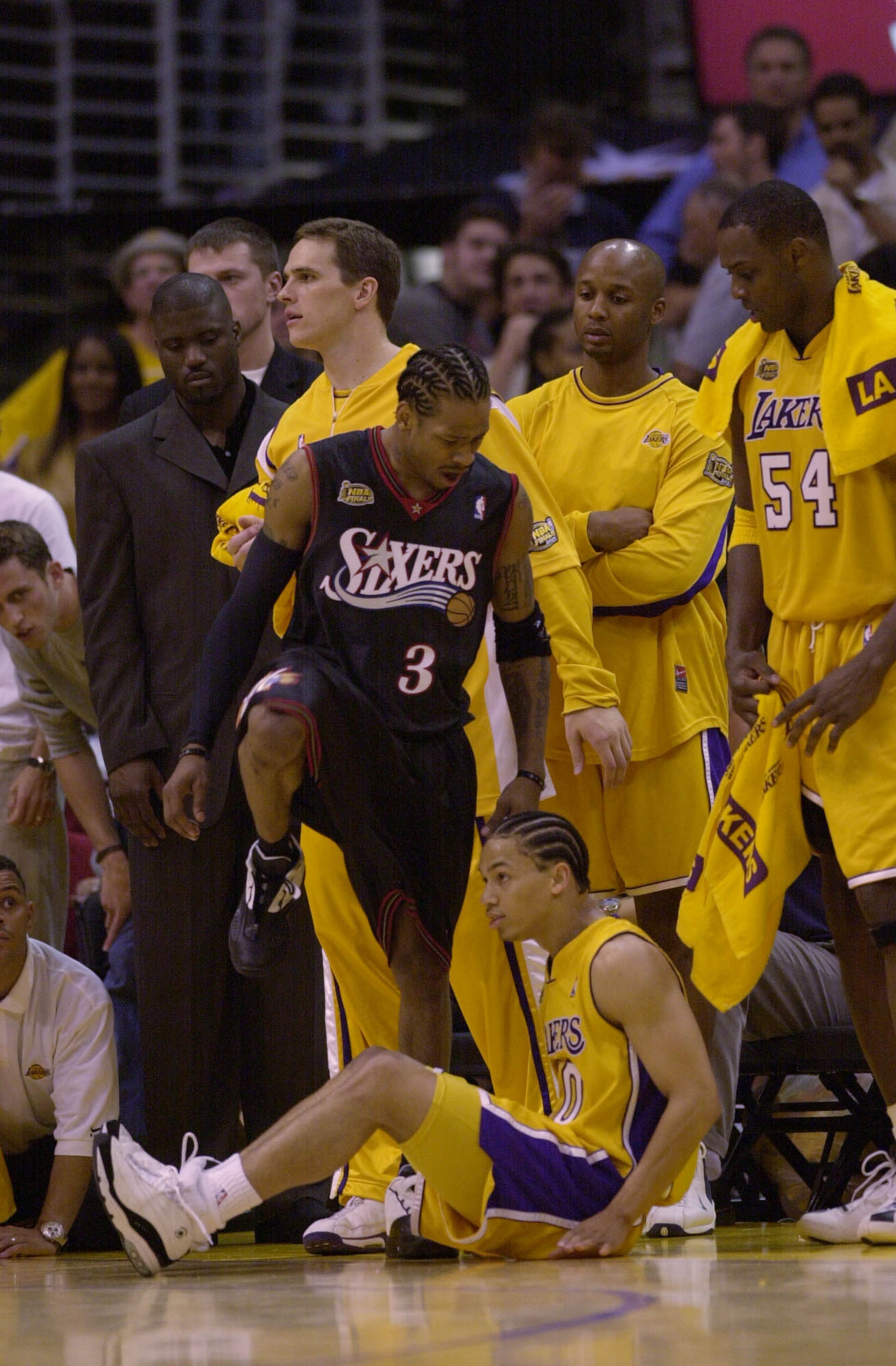 6 Jun 2001:  Allen Iverson #3 of the Philadelphia 76ers steps over Tyronn Lue #10 of the Los Angeles Lakers in game one of the NBA Finals at Staples Center in Los Angeles, California.  The 76ers won 107-101.  DIGITAL IMAGE.  Mandatory Credit: Otto Greule/