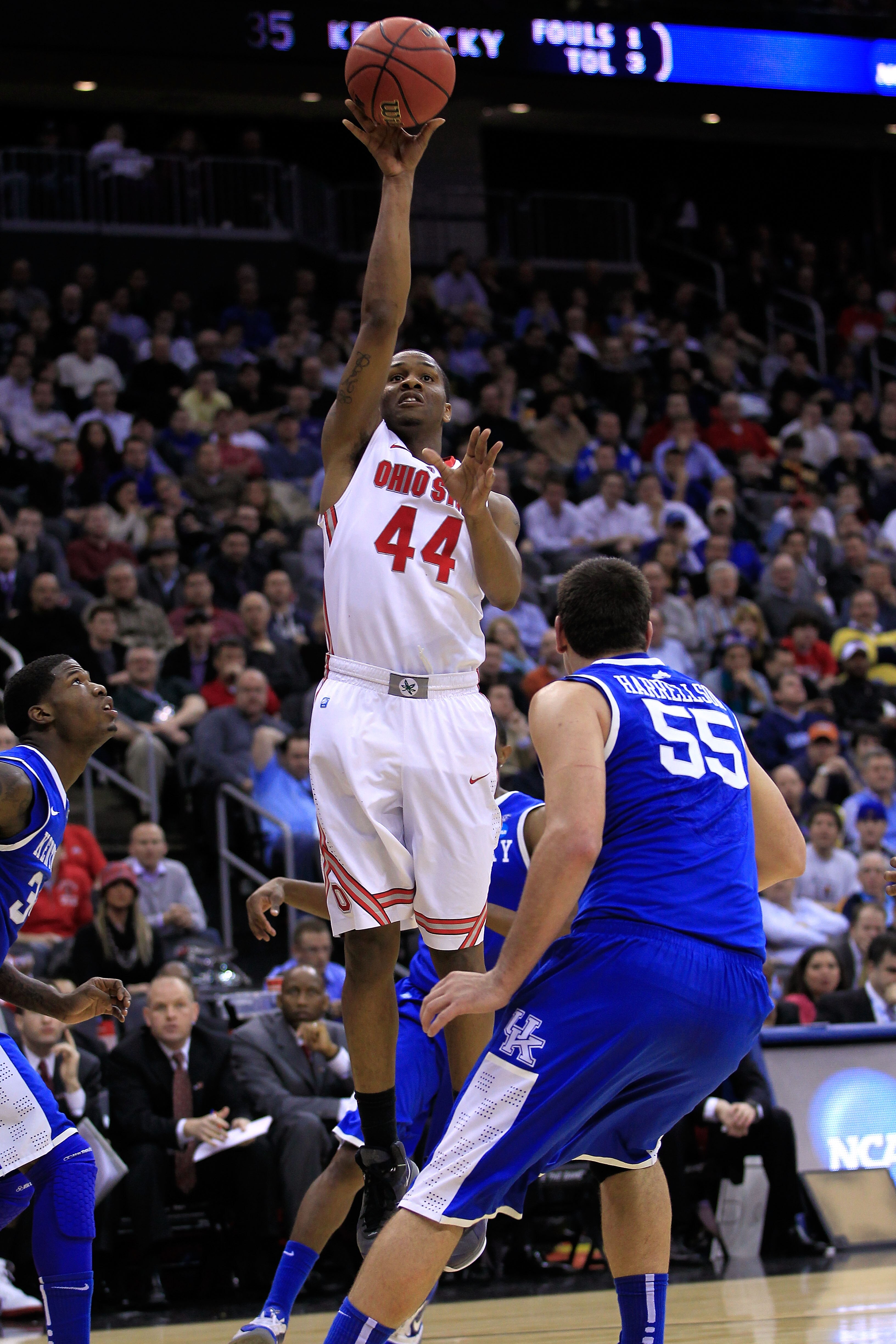 NEWARK, NJ - MARCH 25:  William Buford #44 of the Ohio State Buckeyes against Josh Harrellson #55 of the Kentucky Wildcats during the east regional semifinal of the 2011 NCAA Men's Basketball Tournament at the Prudential Center on March 25, 2011 in Newark