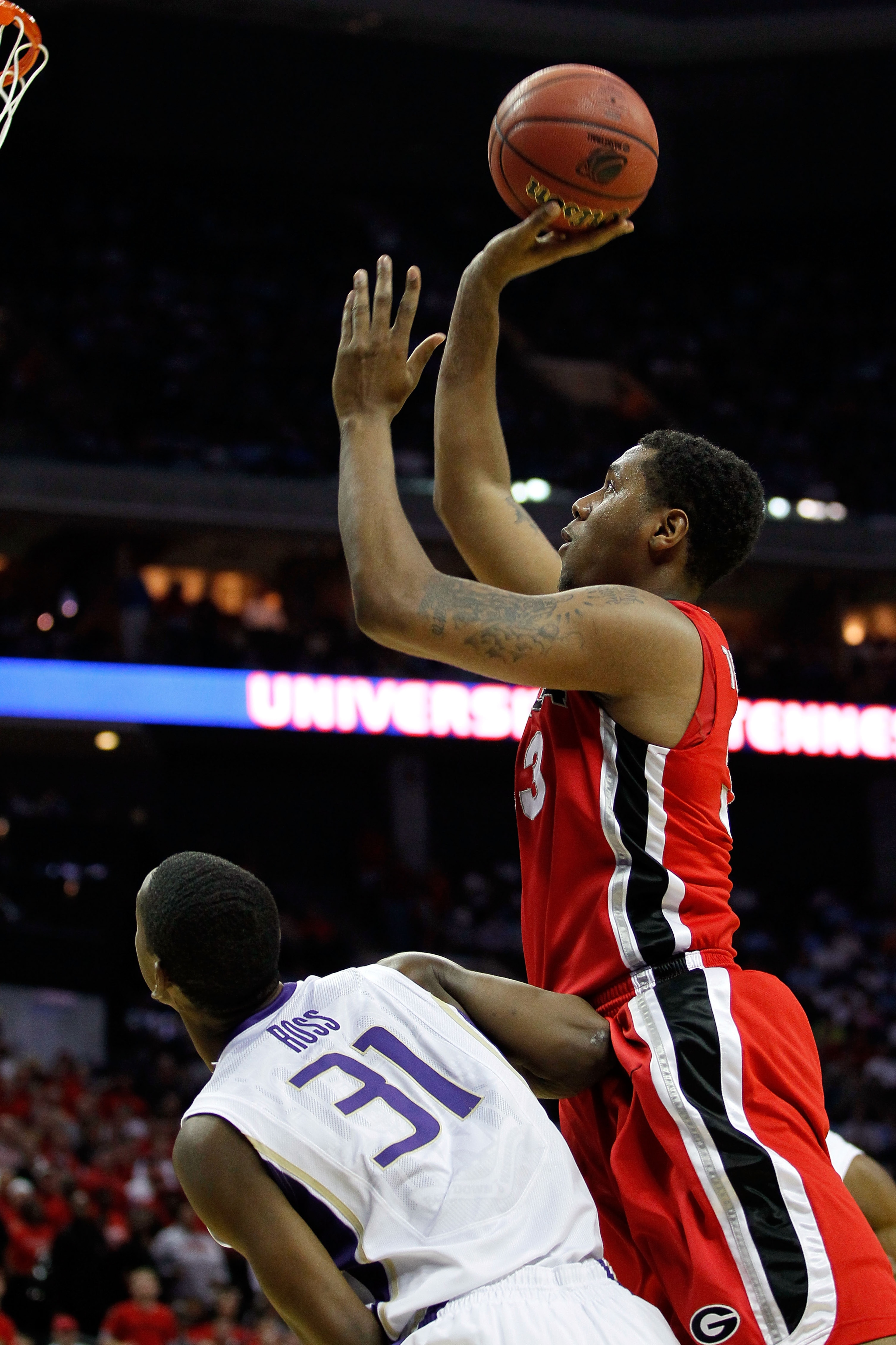 CHARLOTTE, NC - MARCH 18: Trey Thompkins #33 of the Georgia Bulldogs shoots over Terrence Ross #31 of the Washington Huskies in the first half during the second round of the 2011 NCAA men's basketball tournament at Time Warner Cable Arena on March 18, 20 CHARLOTTE, NC - MARCH 18: Trey Thompkins #33 of the Georgia Bulldogs shoots over Terrence Ross #31 of the Washington Huskies in the first half during the second round of the 2011 NCAA men's basketball tournament at Time Warner Cable Arena on March 18, 20
