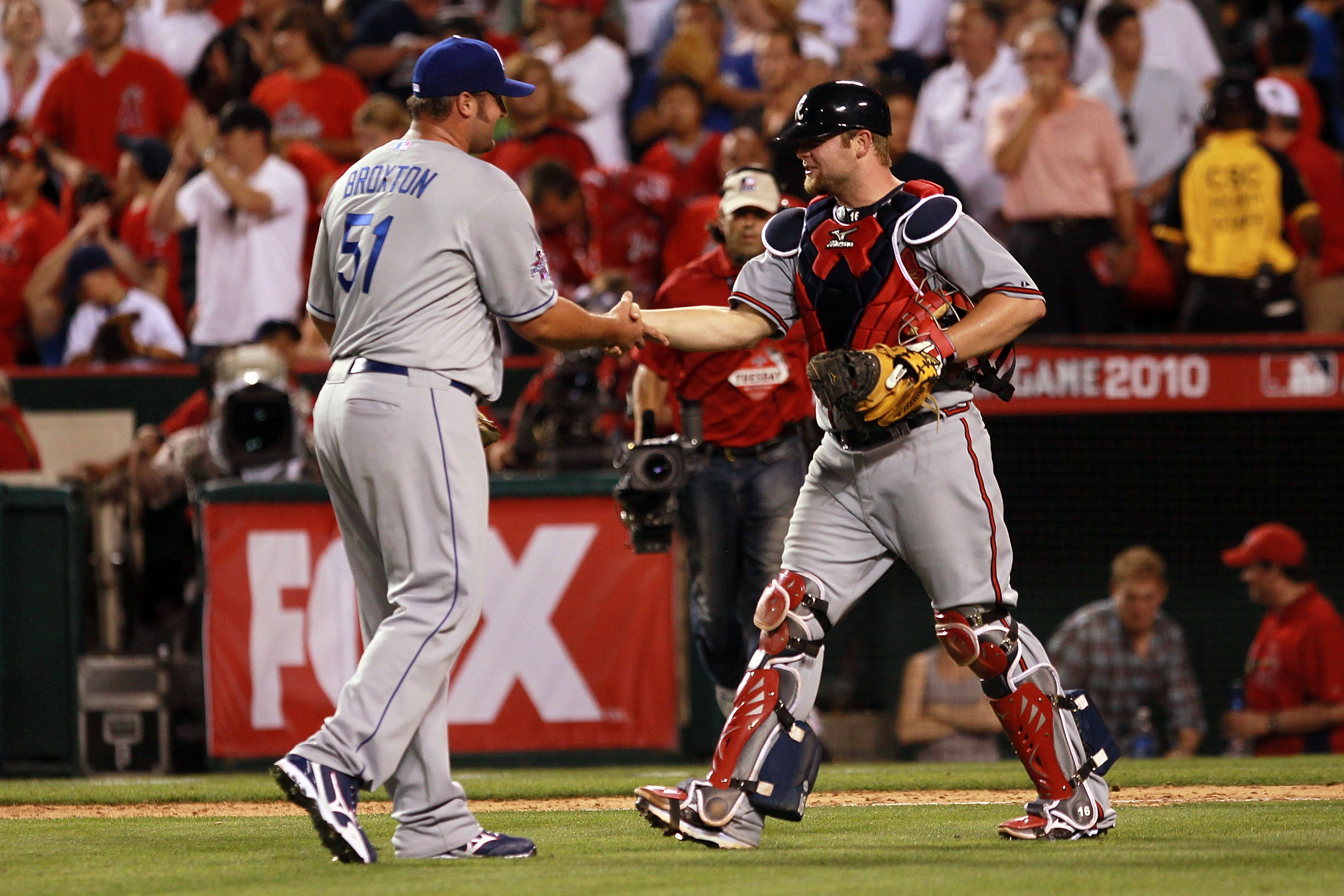 ANAHEIM, CA - JULY 13: National League All-Star Jonathan Broxton #51 of the Los Angeles Dodgers and National League All-Star Brian McCann #16 of the Atlanta Braves celebrate after their win in the 81st MLB All-Star Game at Angel Stadium of Anaheim on Jul ANAHEIM, CA - JULY 13: National League All-Star Jonathan Broxton #51 of the Los Angeles Dodgers and National League All-Star Brian McCann #16 of the Atlanta Braves celebrate after their win in the 81st MLB All-Star Game at Angel Stadium of Anaheim on Jul