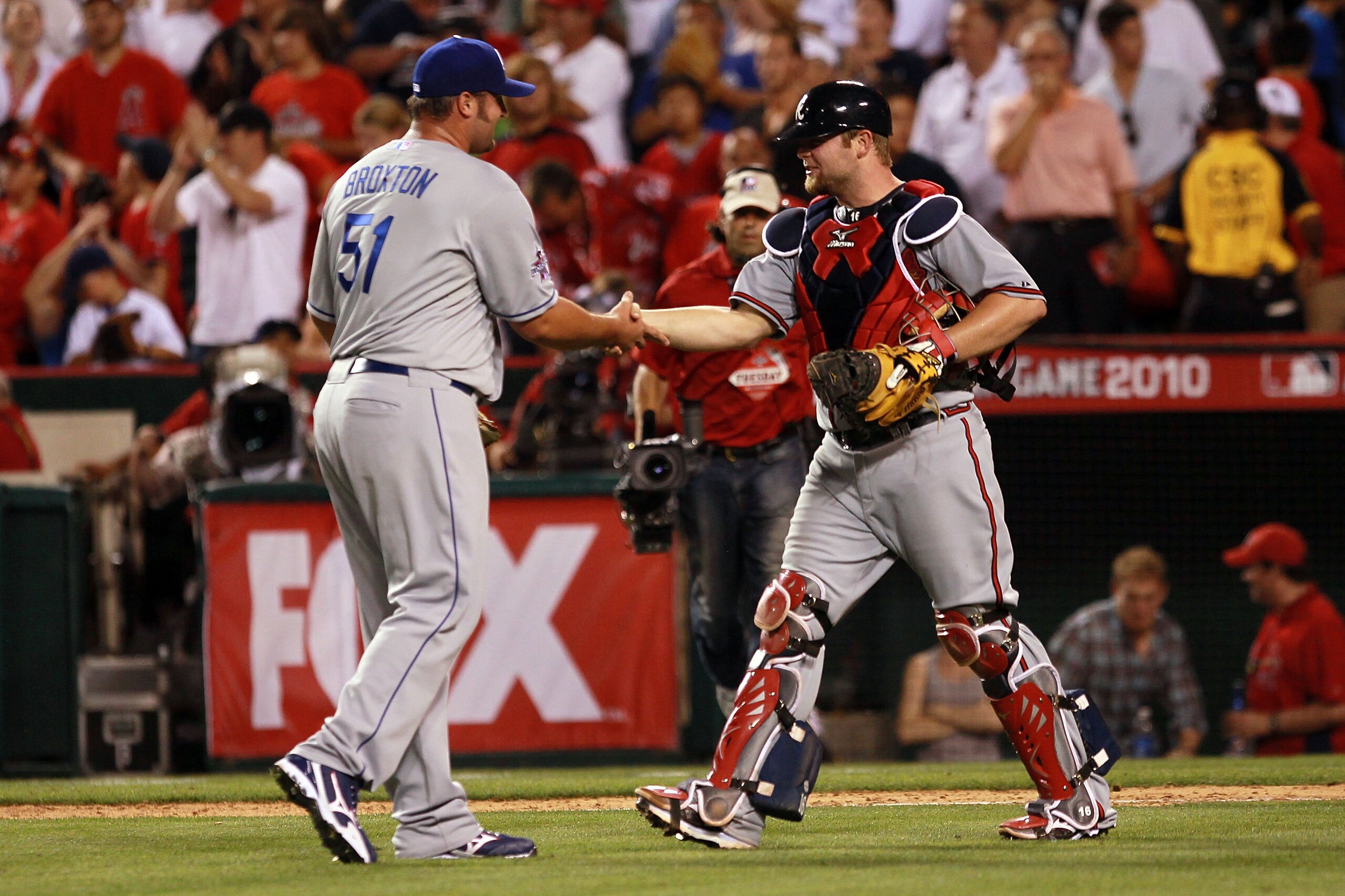 ANAHEIM, CA - JULY 13:  National League All-Star Jonathan Broxton #51 of the Los Angeles Dodgers and National League All-Star Brian McCann #16 of the Atlanta Braves celebrate after their win in the 81st MLB All-Star Game at Angel Stadium of Anaheim on Jul