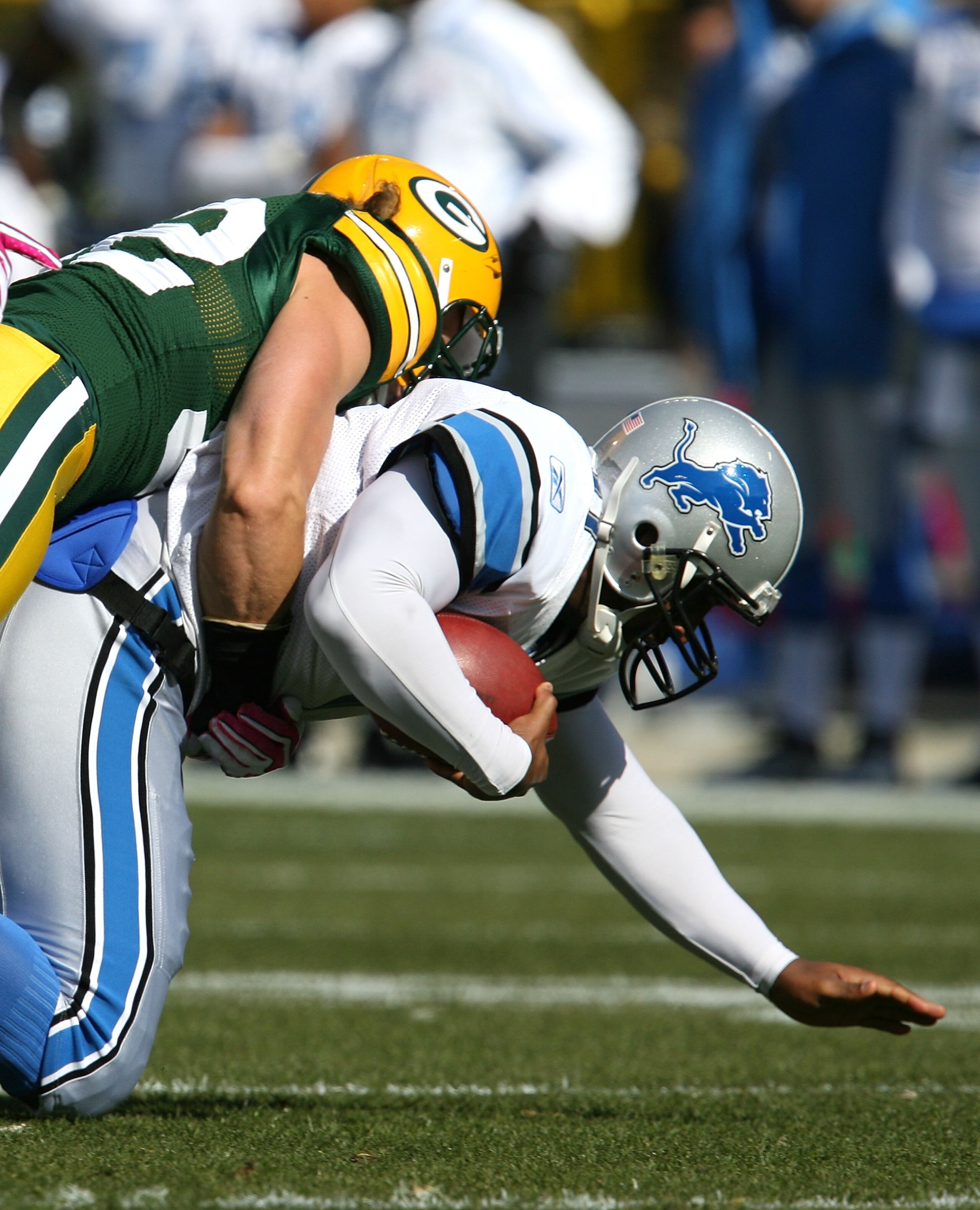 GREEN BAY, WI - OCTOBER 18: Duante Culpepper #11 of the Detroit Lions is sacked by Clay Matthews #52 of the Green Bay Packers at Lambeau Field on October 18, 2009 in Green Bay, Wisconsin. (Photo by Jonathan Daniel/Getty Images)