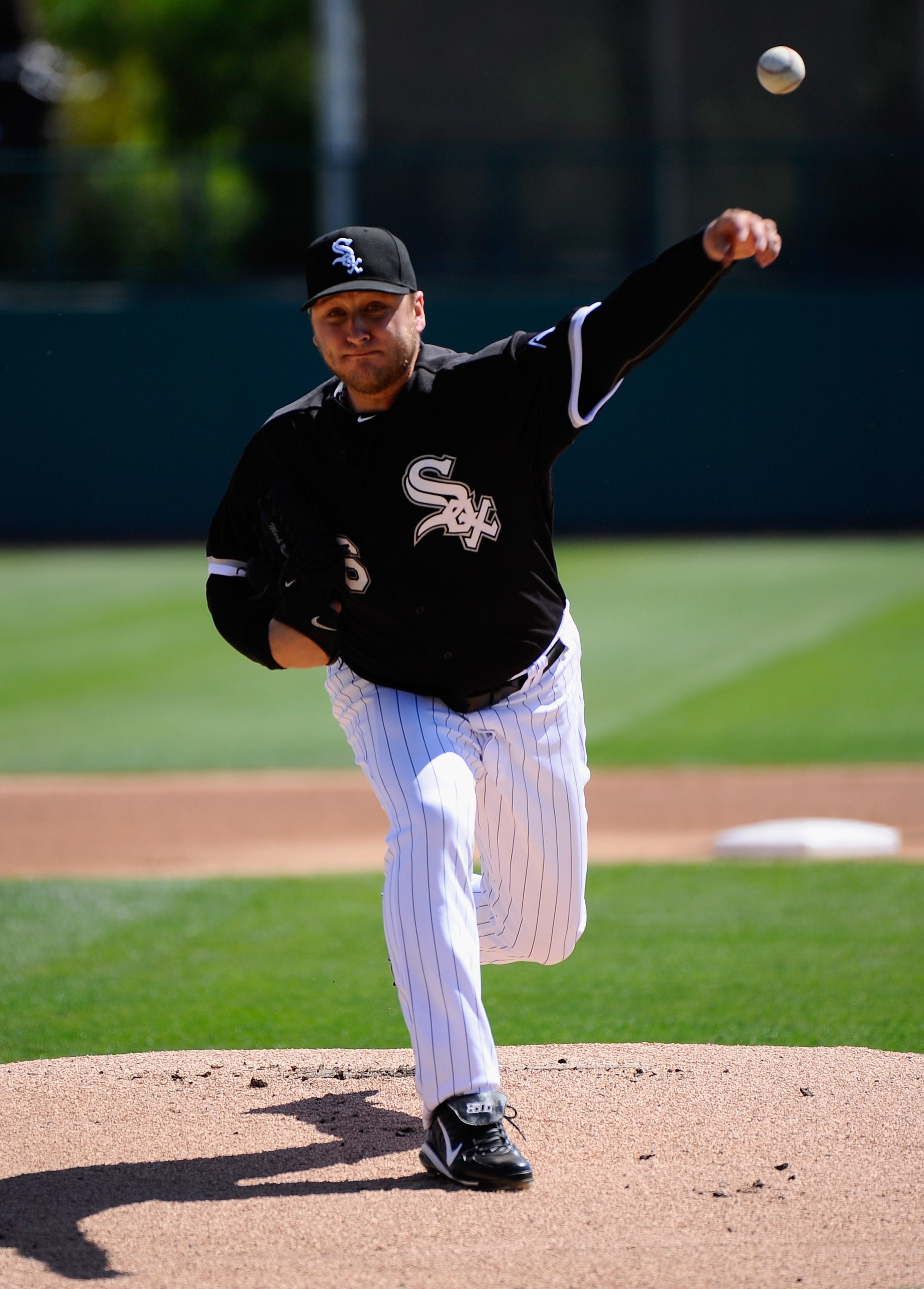 GLENDALE, AZ - MARCH 11:  Pitcher Mark Buehrle #56 of the Chicago White Sox throws a pitch prior to the start of the spring training baseball game against the Chicago Cubs at Camelback Ranch on March 11, 2011 in Glendale, Arizona.  (Photo by Kevork Djanse