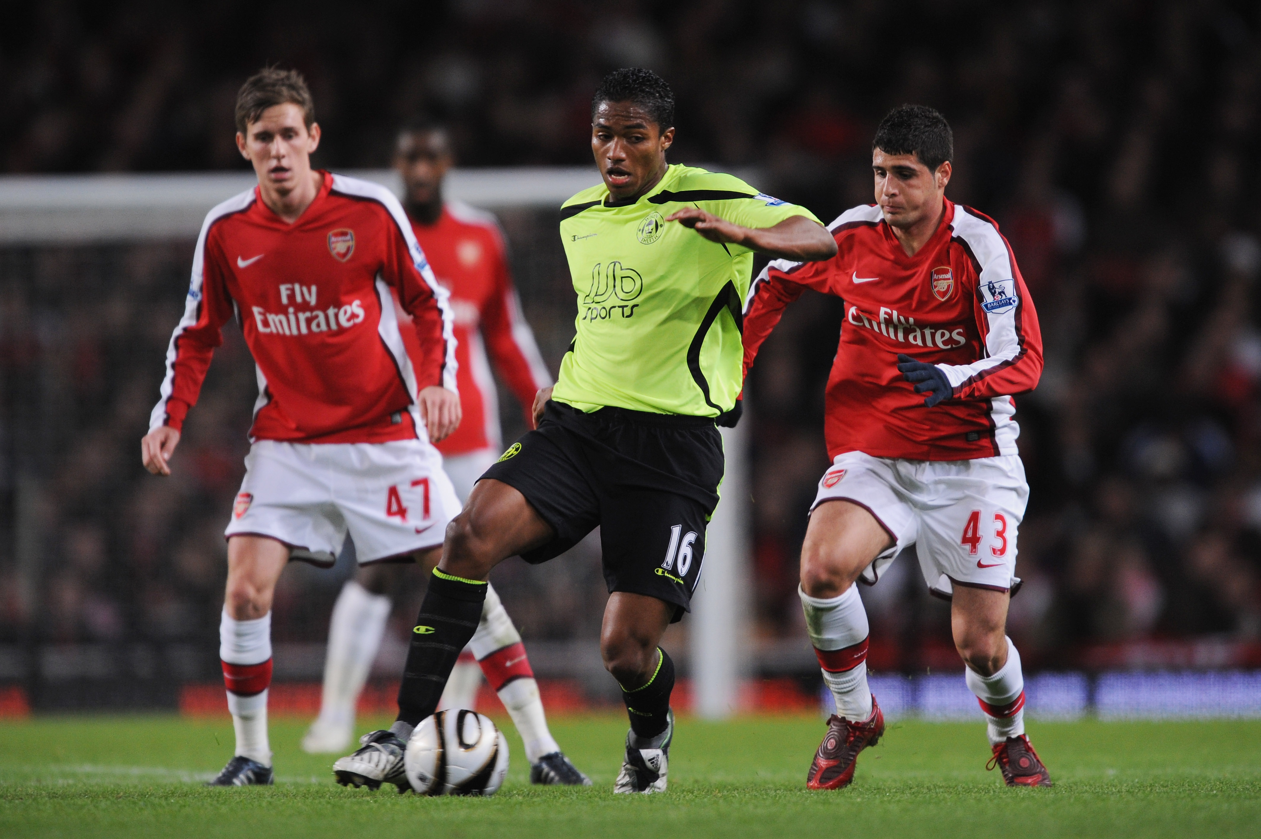 LONDON - NOVEMBER 11:  Antonio Valencia of Wigan is pressurised by Mark Randall  #47 and Fran Merida #43 of Arsenal during the Carling Cup fourth round match between Arsenal and Wigan Athletic at the Emirates Stadium on November 11, 2008 in London, Englan