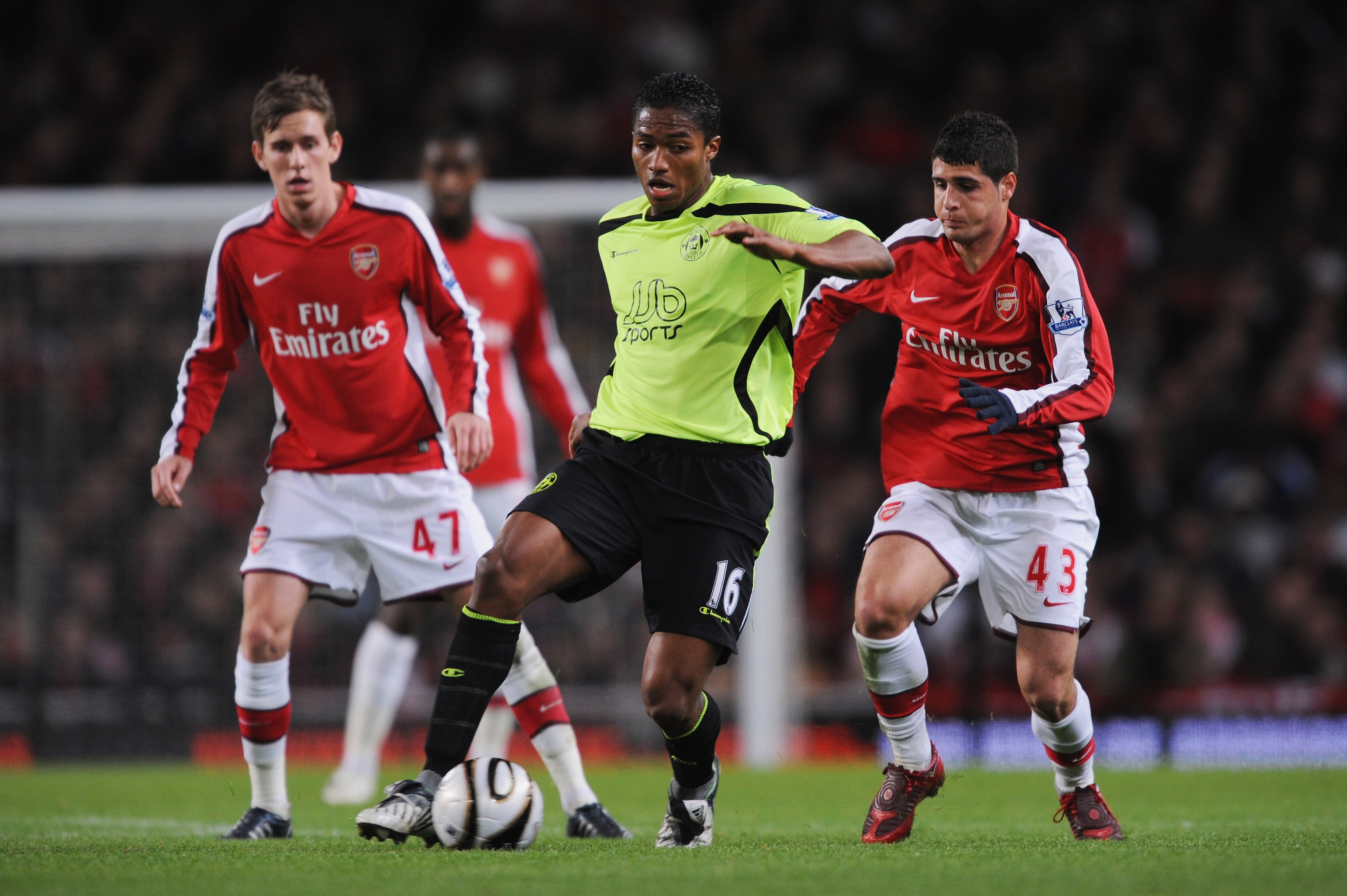 LONDON - NOVEMBER 11: Antonio Valencia of Wigan is pressurised by Mark Randall #47 and Fran Merida #43 of Arsenal during the Carling Cup fourth round match between Arsenal and Wigan Athletic at the Emirates Stadium on November 11, 2008 in London, Englan LONDON - NOVEMBER 11: Antonio Valencia of Wigan is pressurised by Mark Randall #47 and Fran Merida #43 of Arsenal during the Carling Cup fourth round match between Arsenal and Wigan Athletic at the Emirates Stadium on November 11, 2008 in London, Englan