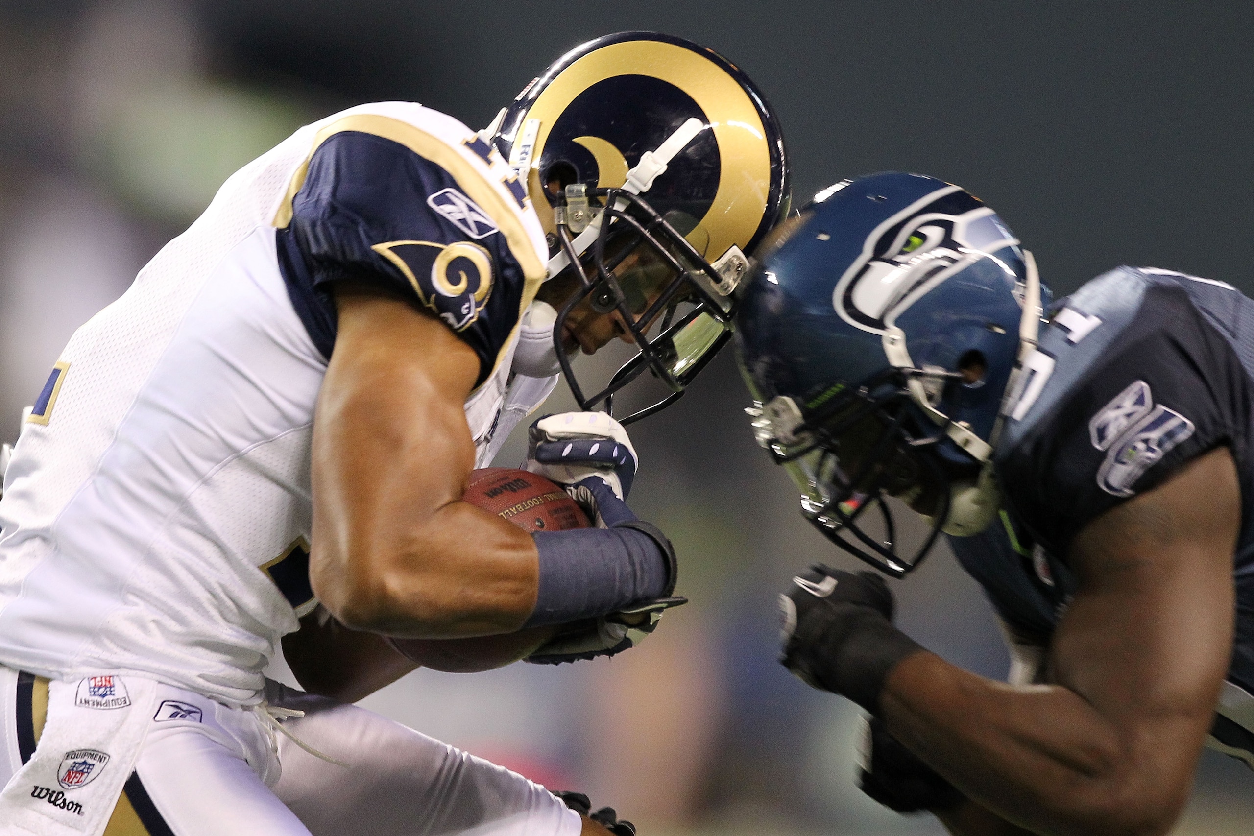 SEATTLE, WA - JANUARY 02:  Defensive end Chris Clemons #91 of the Seattle Seahawks hits wide receiver Brandon Gibson #11 of the St. Louis Rams drawing a personal foul during their game at Qwest Field on January 2, 2011 in Seattle, Washington.  (Photo by O
