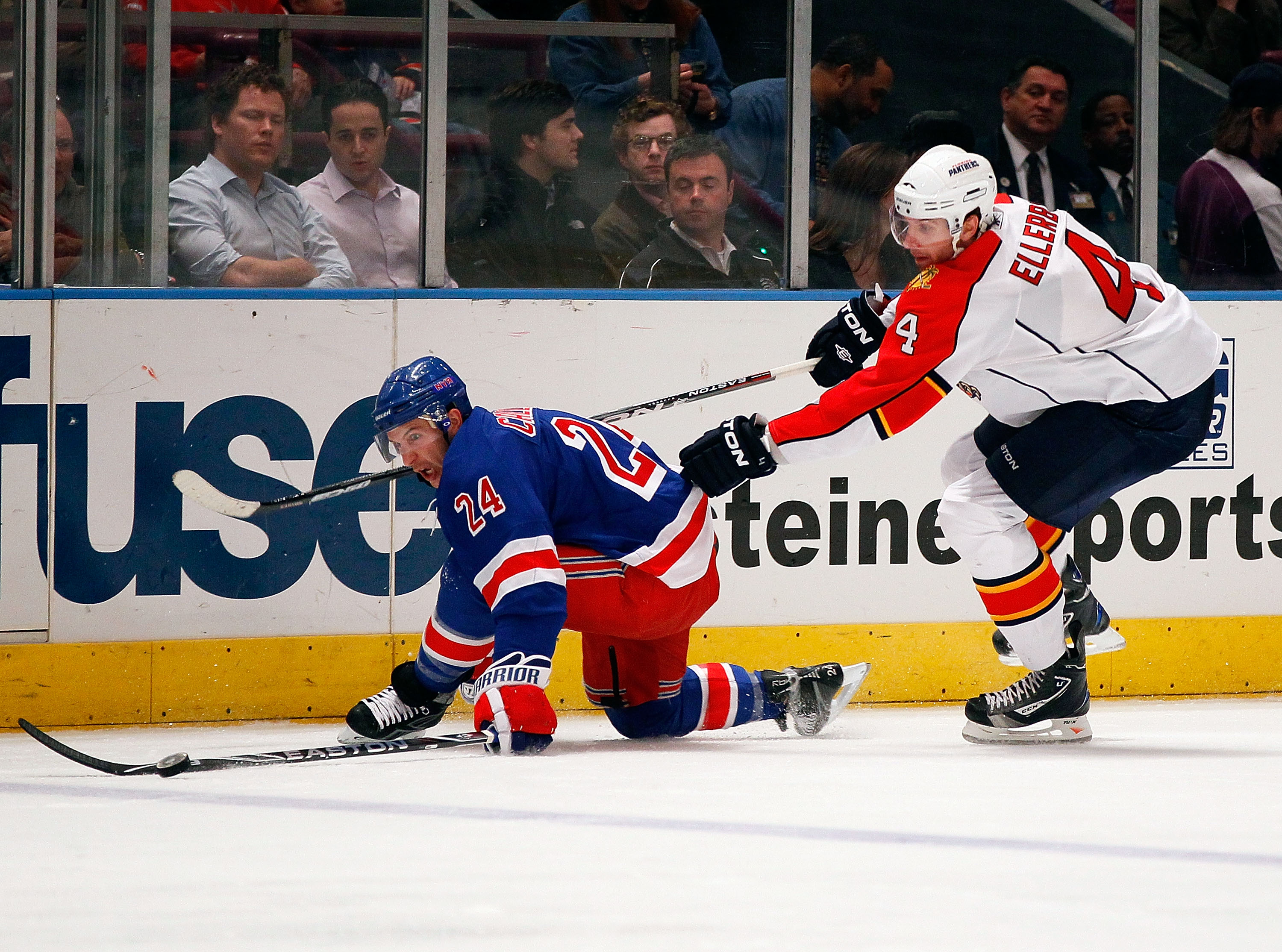 NEW YORK - MARCH 22: Ryan Callahan #24 of the New York Rangers and Keaton Ellerby #4 of the Florida Panthers fall to the ice pursuing the puck on March 22, 2011 at Madison Square Garden in New York City, New York. Rangers defeated the Panthers 1-0. (Photo NEW YORK - MARCH 22: Ryan Callahan #24 of the New York Rangers and Keaton Ellerby #4 of the Florida Panthers fall to the ice pursuing the puck on March 22, 2011 at Madison Square Garden in New York City, New York. Rangers defeated the Panthers 1-0. (Photo
