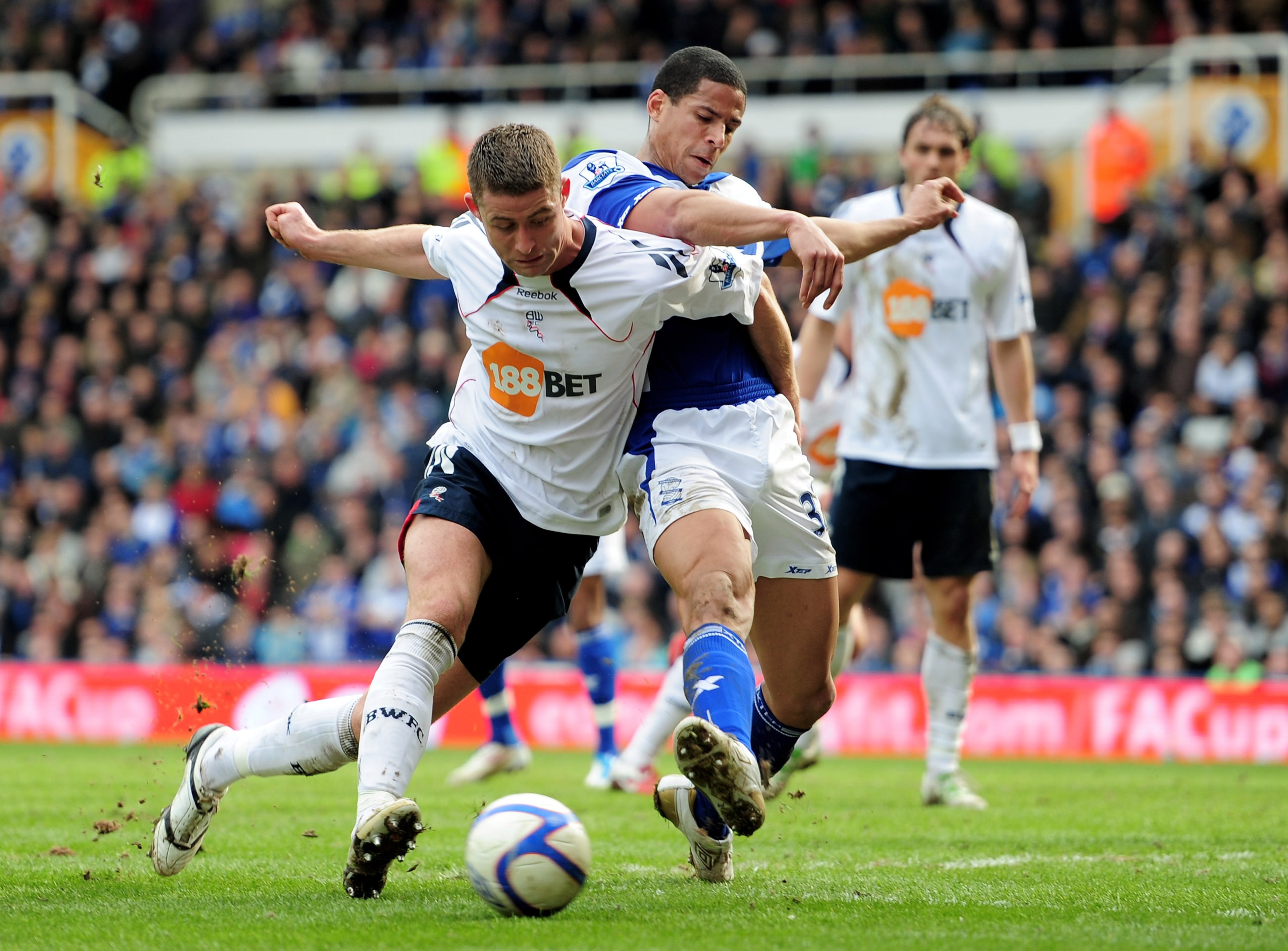 BIRMINGHAM, ENGLAND - MARCH 12: Gary Cahill of Bolton Wanderers holds off a challenge from Curtis Davies of Birmingham City during the FA Cup sponsored by E.On Sixth Round match between Birmingham City and Bolton Wanderers at St Andrews on March 12, 2011 BIRMINGHAM, ENGLAND - MARCH 12: Gary Cahill of Bolton Wanderers holds off a challenge from Curtis Davies of Birmingham City during the FA Cup sponsored by E.On Sixth Round match between Birmingham City and Bolton Wanderers at St Andrews on March 12, 2011