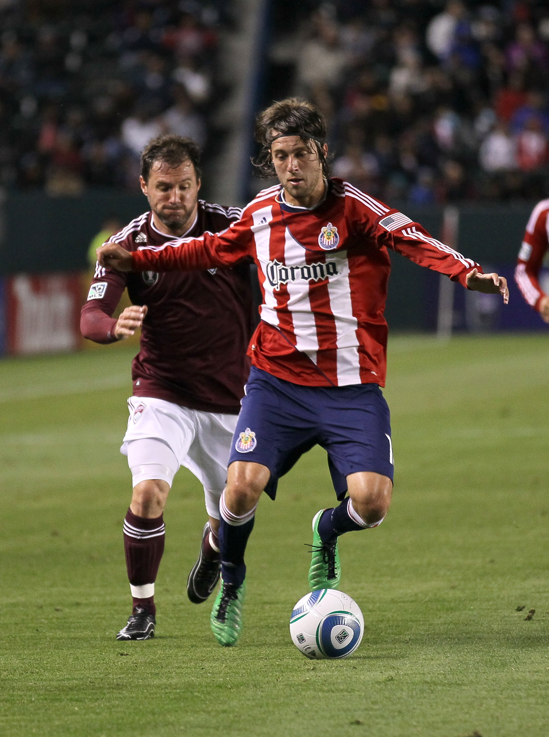 CARSON, CA - MARCH 26: Blair Gavin #18 of Chivas USA fights for the ball with Jamie Smith #20 of the Colorado Rapids at The Home Depot Center on March 26, 2011 in Carson, California. The Rapids won 1-0. (Photo by Stephen Dunn/Getty Images)