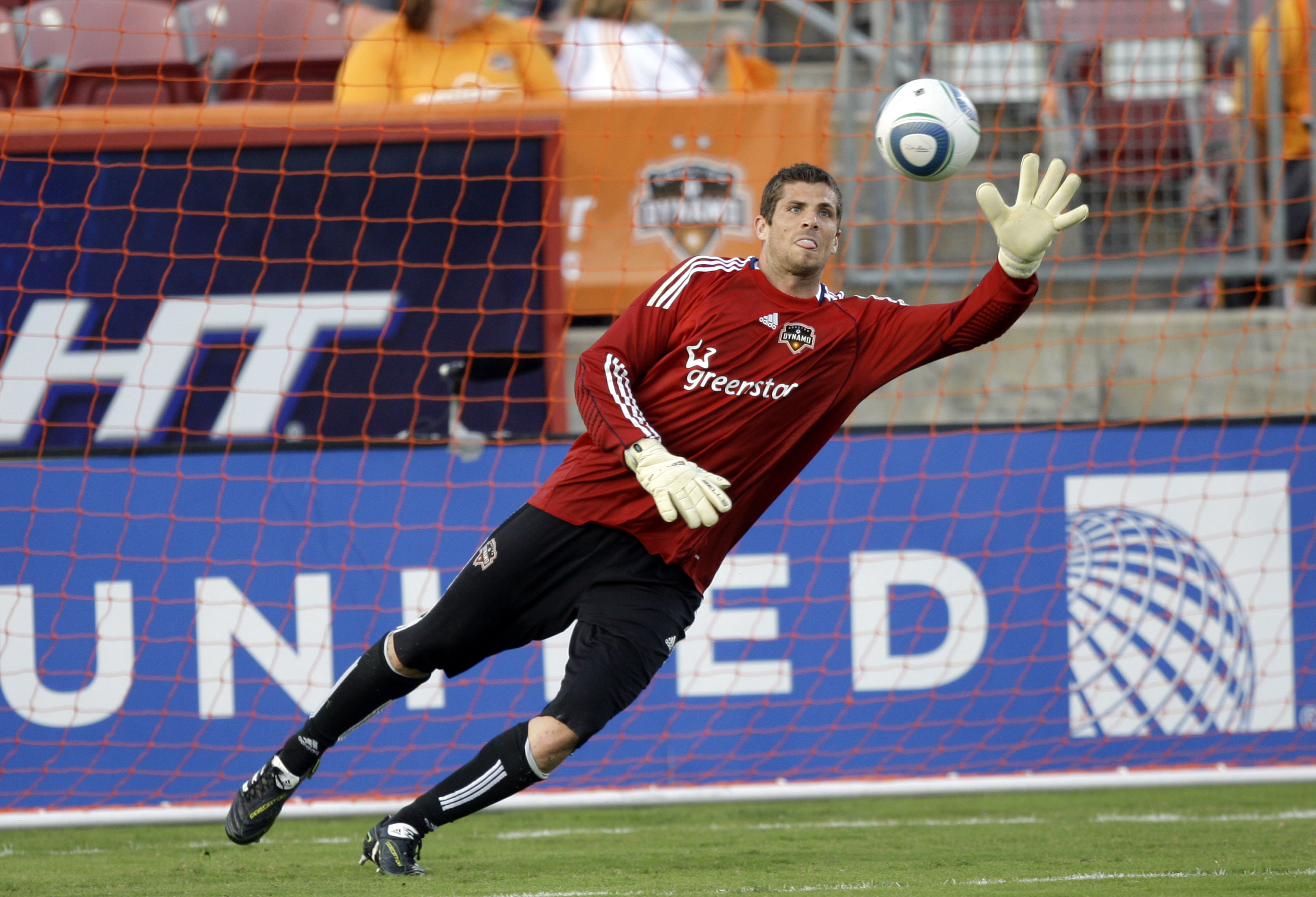 HOUSTON - MARCH 19: Goalkeeper Tally Hall of the Houston Dynamo stopsa shot during warmups before playing the Philadelphia Union at Robertson Stadium on March 19, 2011 in Houston, Texas. (Photo by Bob Levey/Getty Images)