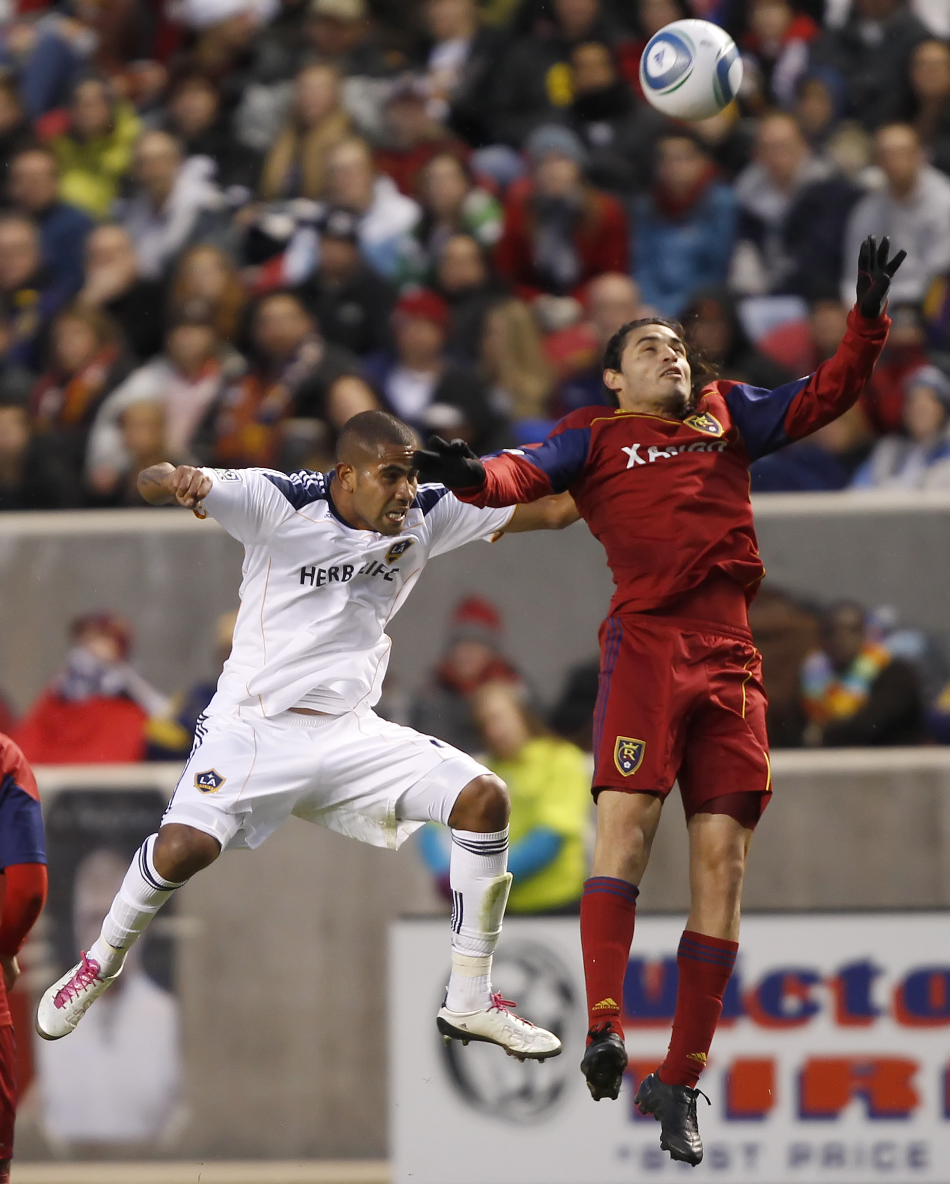 SANDY, UT - MARCH 26: Fabian Espindola #7 of Real Salt Lake and Leonardo #22 of the Los Angeles Galaxy fight for the ball during the first half of an MLS soccer game March 26, 2011 at Rio Tinto Stadium in Sandy, Utah. Real Salt Lake beat the Los Angeles G