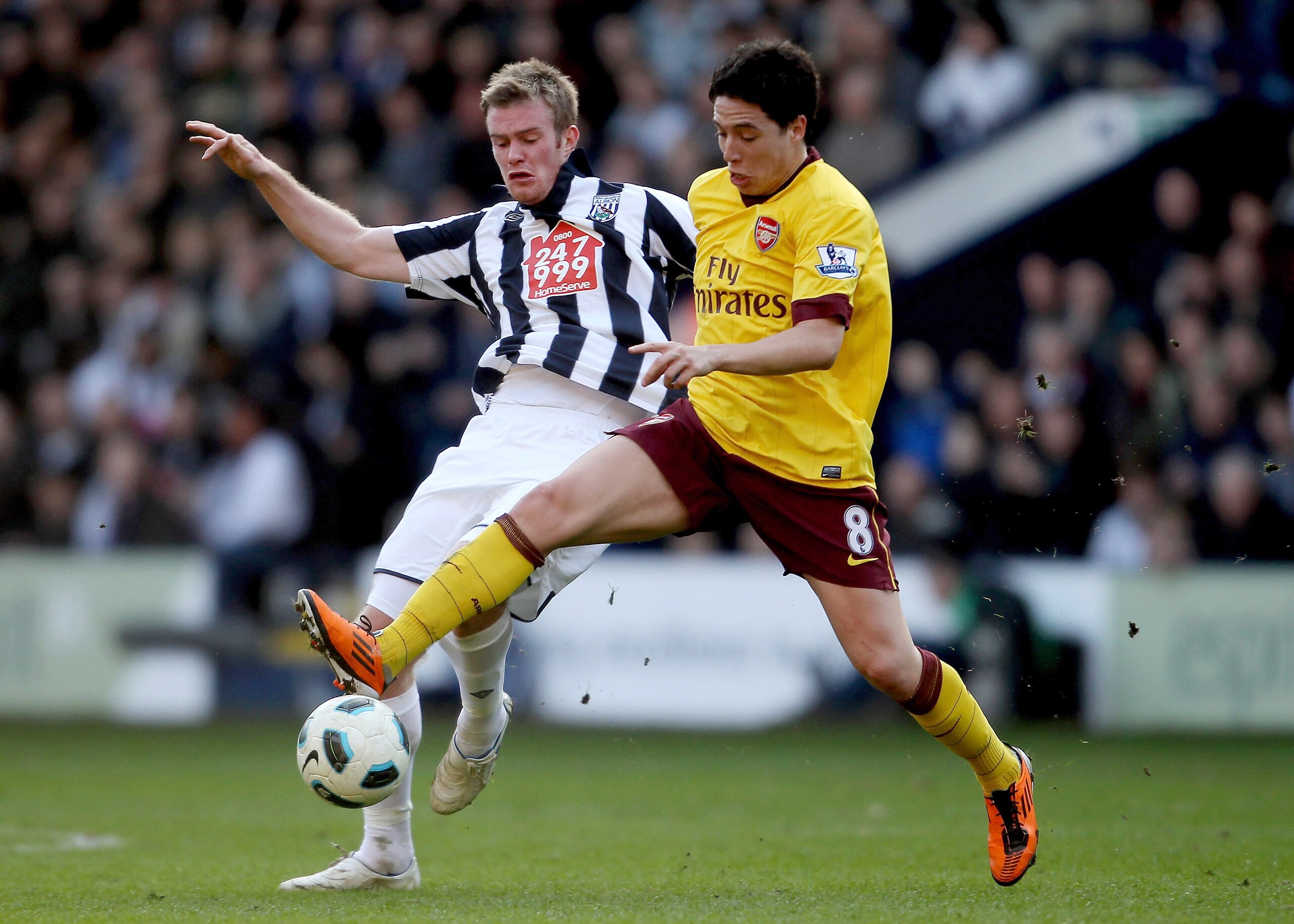 WEST BROMWICH, ENGLAND - MARCH 19:  Chris Brunt of WBA (L) in action with Samir Nasri of Arsenal during the Barclays Premier League match between West Bromwich Albion and Arsenal at The Hawthorns on March 19, 2011 in West Bromwich, England.  (Photo by Sco