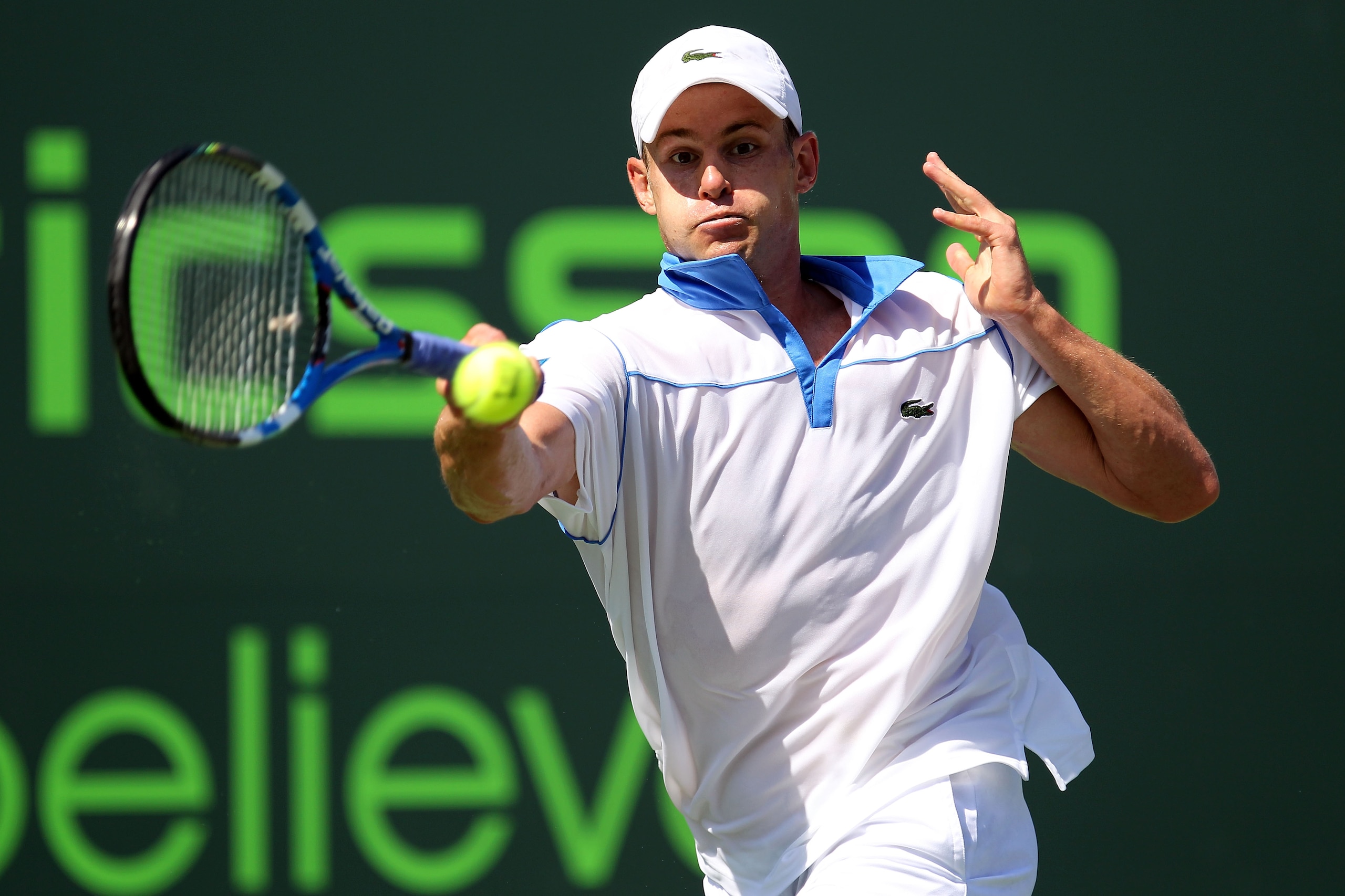 KEY BISCAYNE, FL - MARCH 26:  Andy Roddick hits a forehand return against Pablo Cuevas of Uruguay during the Sony Ericsson Open at Crandon Park Tennis Center on March 26, 2011 in Key Biscayne, Florida.  (Photo by Al Bello/Getty Images)