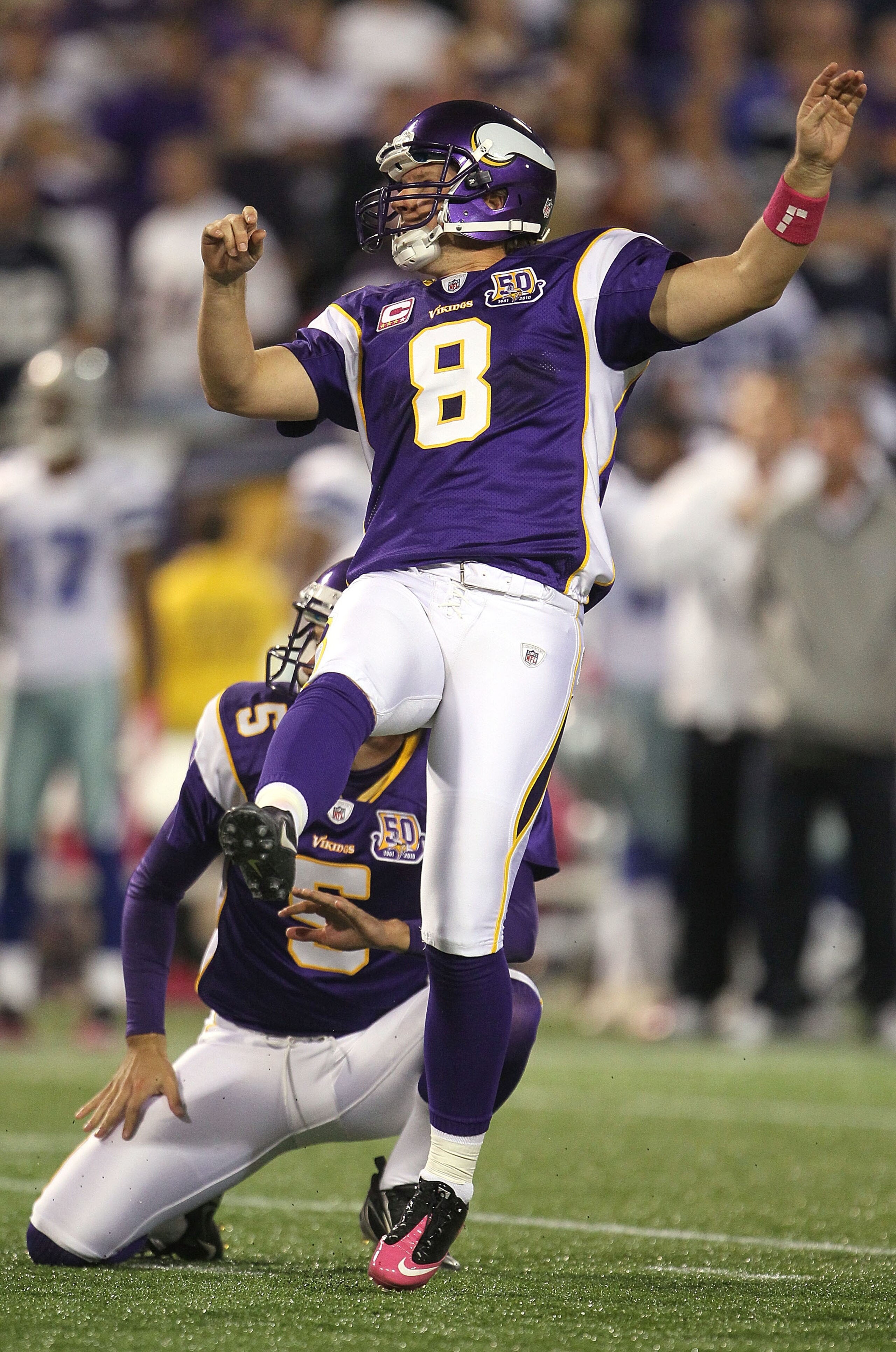 MINNEAPOLIS - OCTOBER 17:  Kicker Ryan Longwell #8 of the Minnesota Vikings kicks the go ahead field goal as place kicker Chris Kluwe #5 holds against the Dallas Cowboys during the fourth quarter at Mall of America Field on October 17, 2010 in Minneapolis
