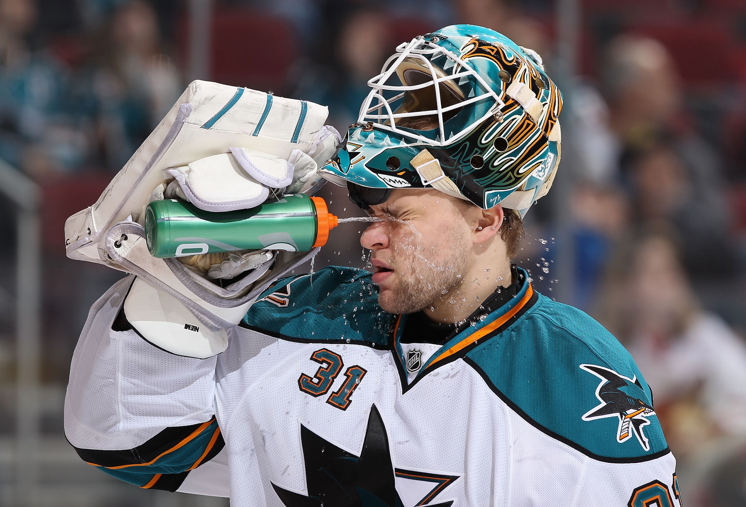 GLENDALE, AZ - MARCH 26:  Goaltender Antti Niemi #31 of the San Jose Sharks sprays himself with water before the start of the second period of the NHL game against the Phoenix Coyotes at Jobing.com Arena on March 26, 2011 in Glendale, Arizona.  (Photo by