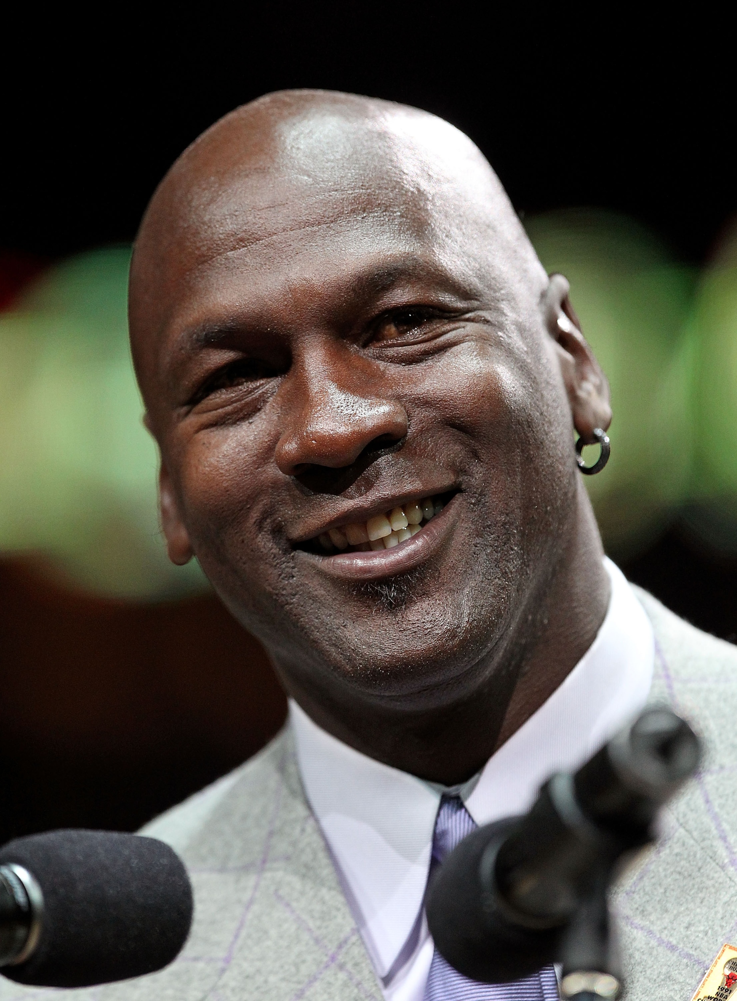 CHICAGO, IL - MARCH 12: Former player Michael Jordan of the Chicago Bulls addresses the crowd during a 20th anniversary recognition ceremony of the Bulls 1st NBA Championship in 1991 during half-time of a game bewteen the Bulls and the Utah Jazz at the Un