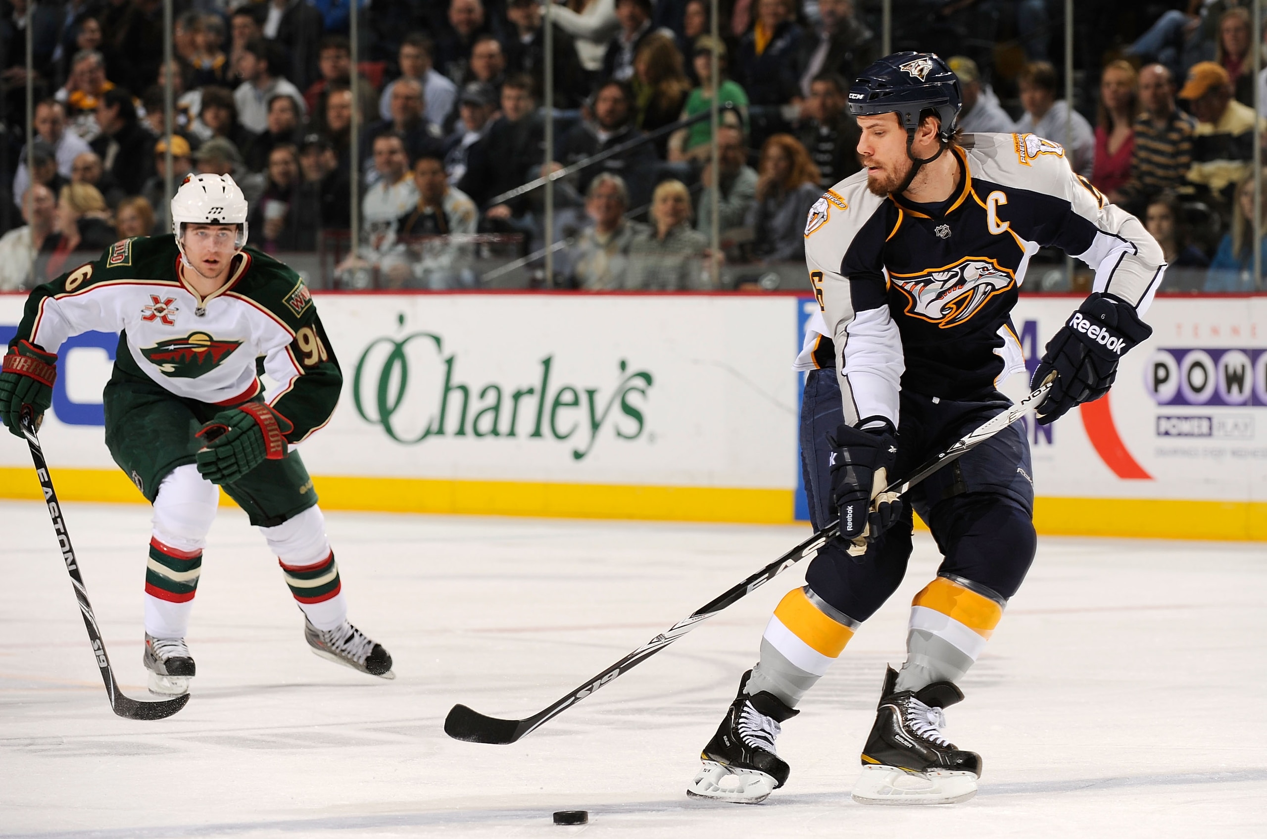 NASHVILLE, TN - MARCH 10:  Shea Weber #6 of the Nashville Predators carries the puck past Pierre-Marc Bouchard #96 of the Minnesota Wild on March 10, 2011 at the Bridgestone Arena in Nashville, Tennessee.  (Photo by Frederick Breedon/Getty Images)