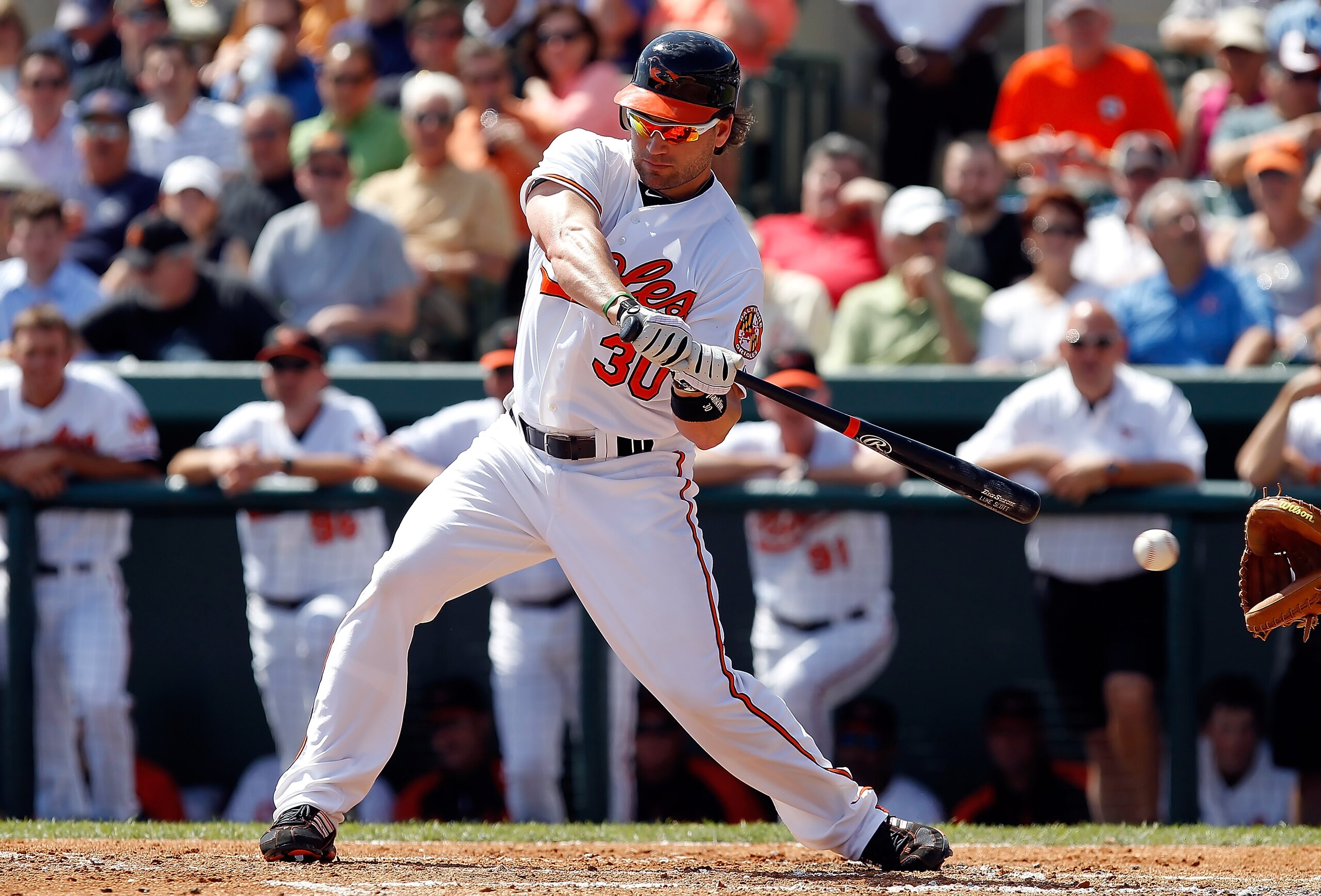 SARASOTA, FL - MARCH 03:  Outfielder Luke Scott #30 of the Baltimore Orioles looks at a strike against the Minnesota Twins during a Grapefruit League Spring Training Game at Ed Smith Stadium on March 3, 2011 in Sarasota, Florida.  (Photo by J. Meric/Getty