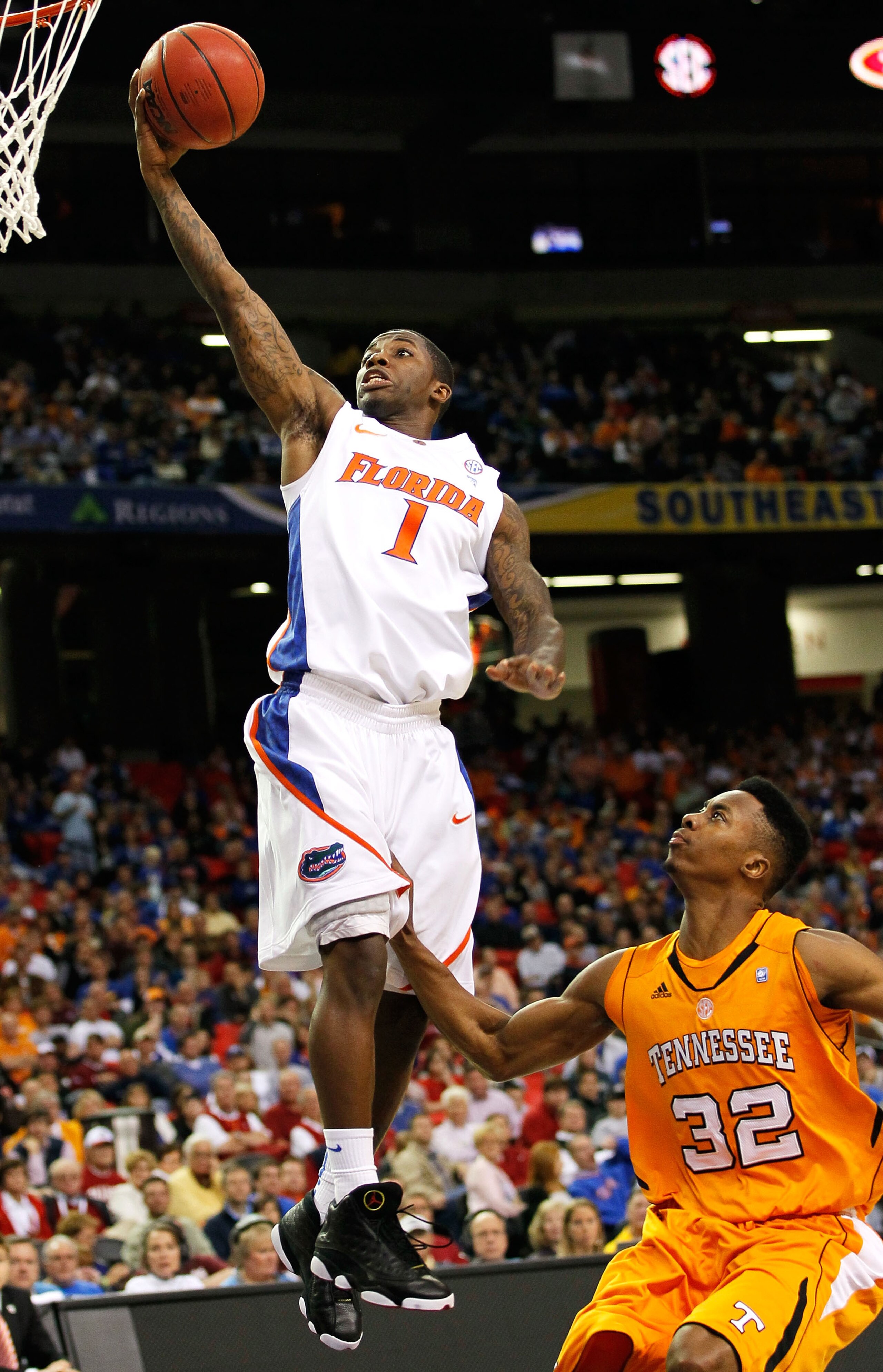 ATLANTA, GA - MARCH 11:  Kenny Boynton #1 of the Florida Gators shoots over Scotty Hopson #32 of the Tennessee Volunteers during the quarterfinals of the SEC Men's Basketball Tournament at Georgia Dome on March 11, 2011 in Atlanta, Georgia.  (Photo by Kev