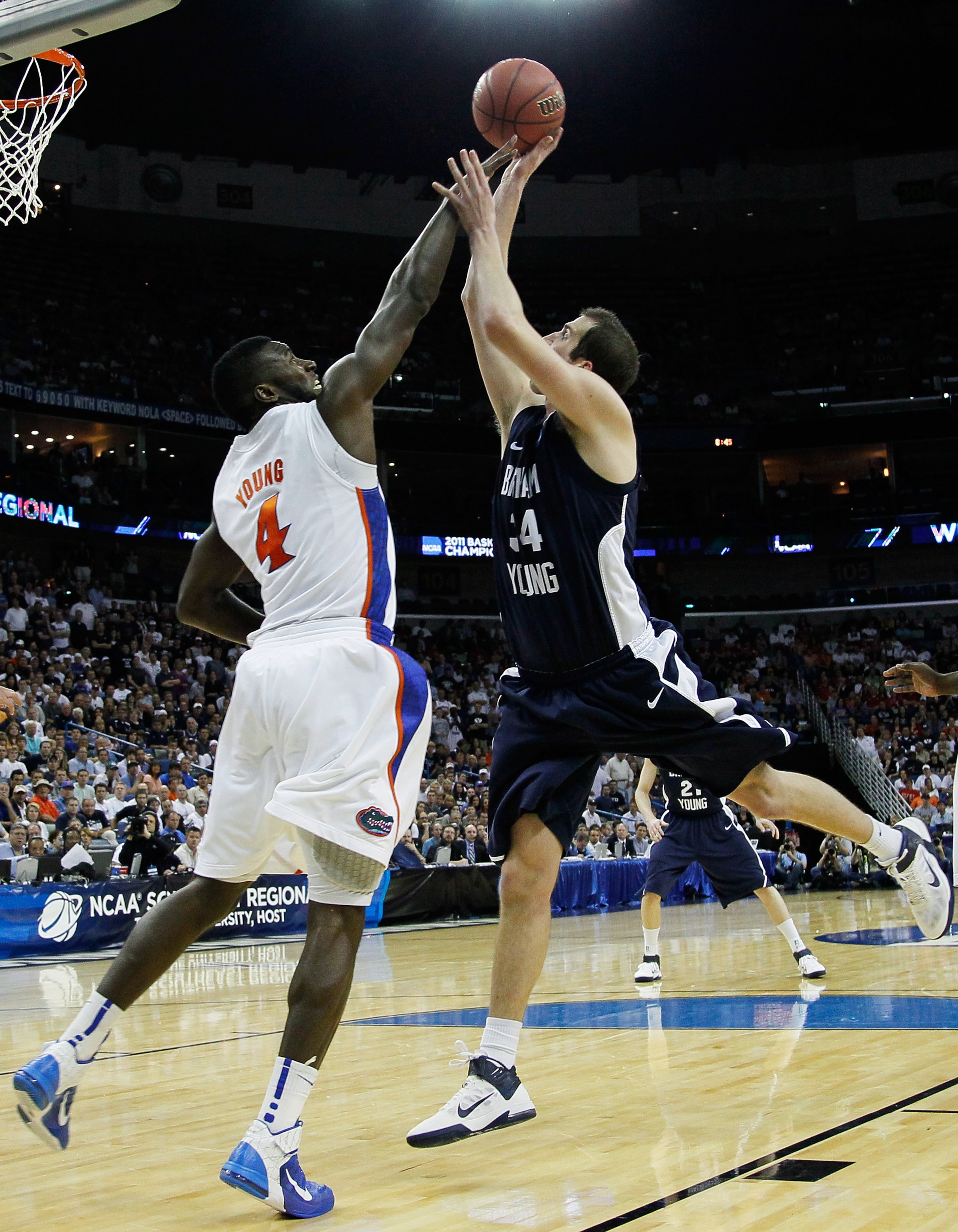 NEW ORLEANS, LA - MARCH 24:  Noah Hartsock #34 of the Brigham Young Cougars shoots against Patric Young #4 of the Florida Gators during the Southeast regional of the 2011 NCAA men's basketball tournament at New Orleans Arena on March 24, 2011 in New Orlea