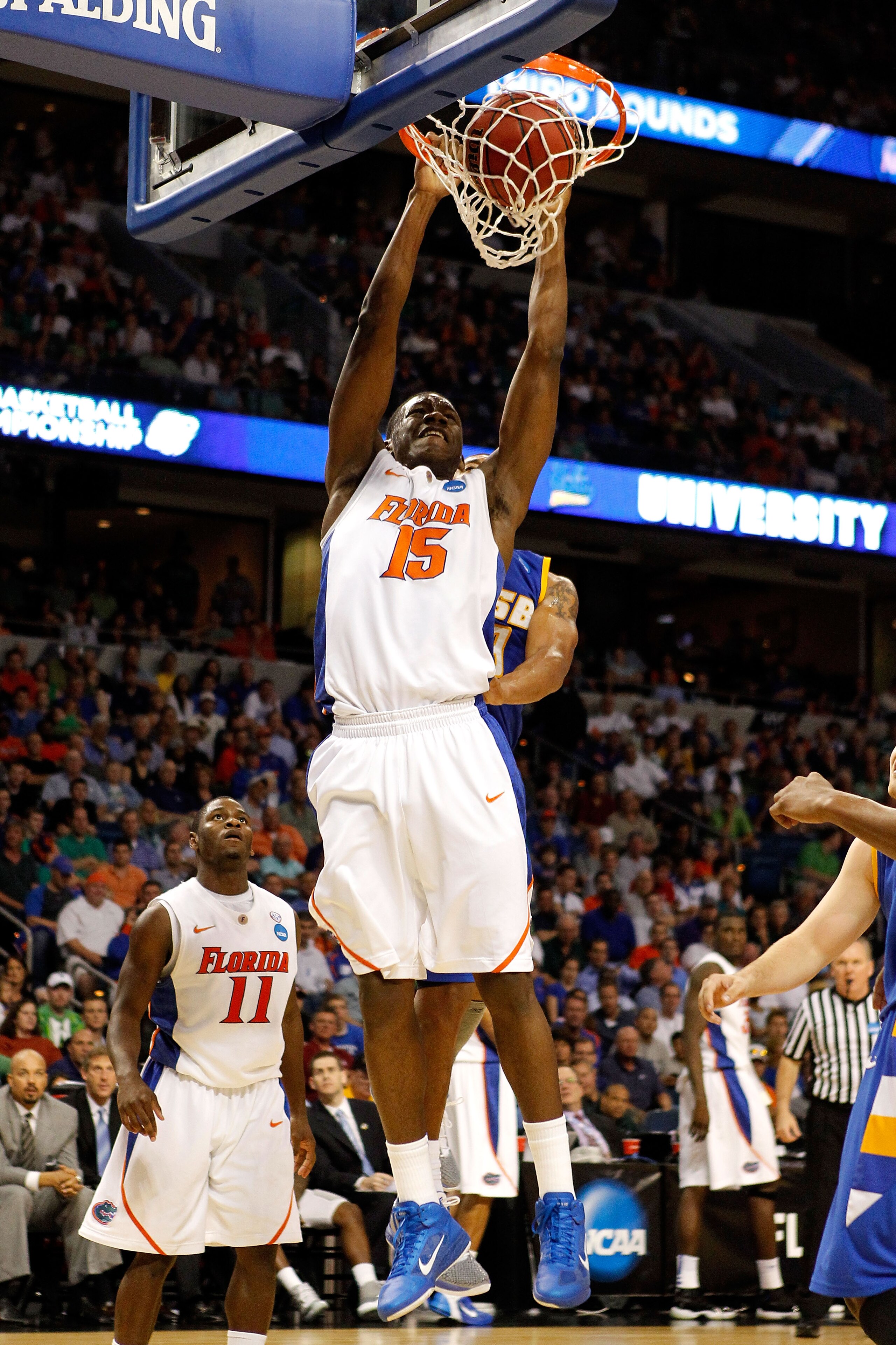 TAMPA, FL - MARCH 17:  Will Yeguete #15 of the Florida Gators dunks against the UC Santa Barbara Gauchos during the second round of the 2011 NCAA men's basketball tournament at St. Pete Times Forum on March 17, 2011 in Tampa, Florida. Florida won 79-51. (