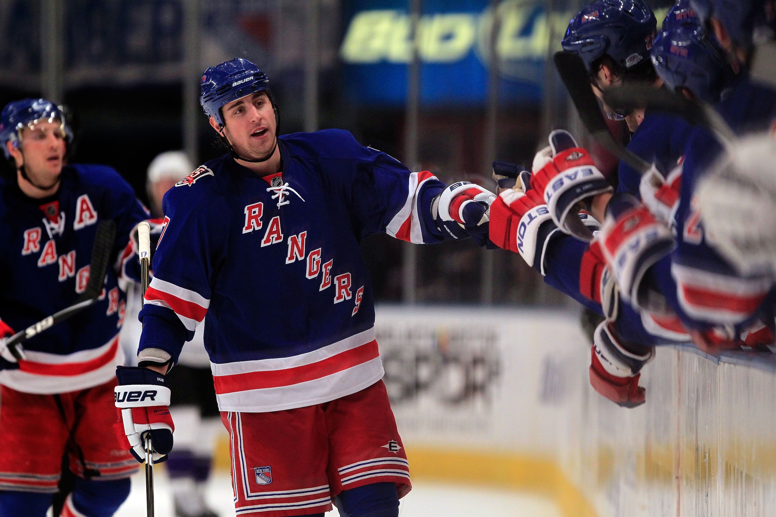 NEW YORK, NY - FEBRUARY 17:  Brandon Dubinsky #17 of the New York Rangers is congratulated by his teammates for his goal in the third period against the Los Angeles Kings on February 17, 2011 in New York City. The Rangers defeated the Kings 4-3 after a sh
