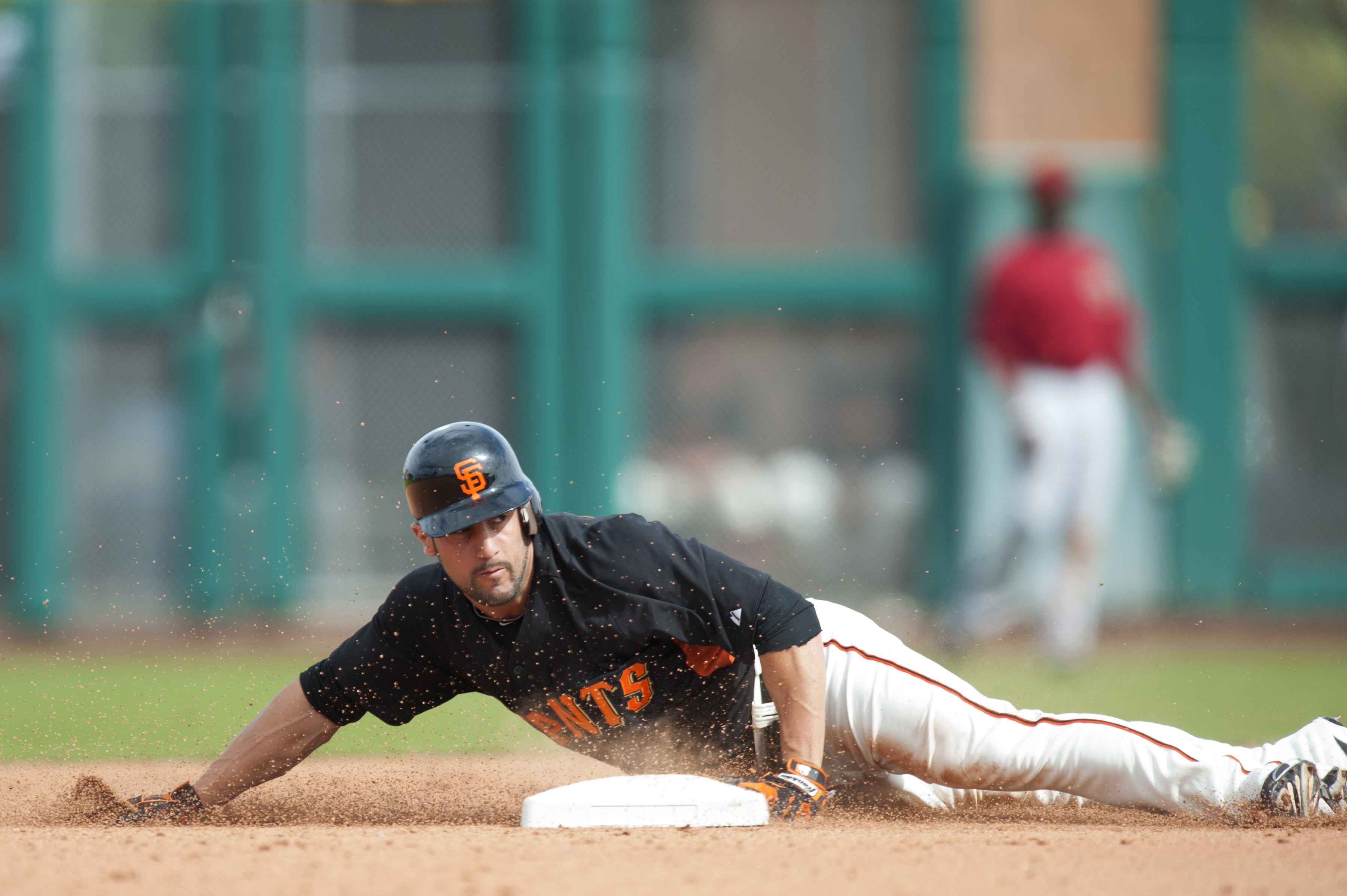 SCOTTSDALE, AZ - FEBRUARY 25: Andres Torres #56  of the San Francisco Giants attempts to steal second base during a spring training game against the Arizona Diamondbacks at Scottsdale Stadium on February 25, 2011 in Scottsdale, Arizona. (Photo by Rob Trin