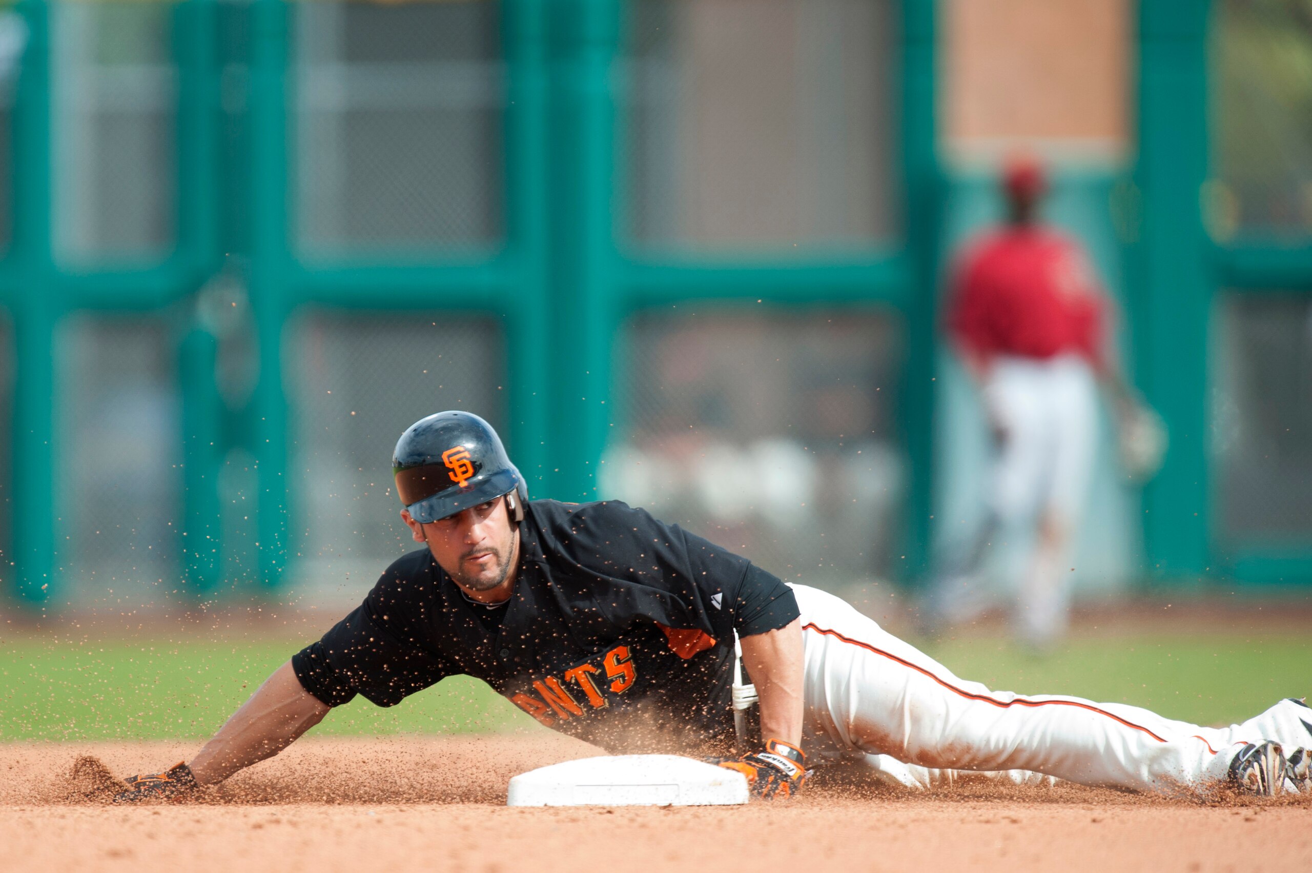 SCOTTSDALE, AZ - FEBRUARY 25: Andres Torres #56  of the San Francisco Giants attempts to steal second base during a spring training game against the Arizona Diamondbacks at Scottsdale Stadium on February 25, 2011 in Scottsdale, Arizona. (Photo by Rob Trin