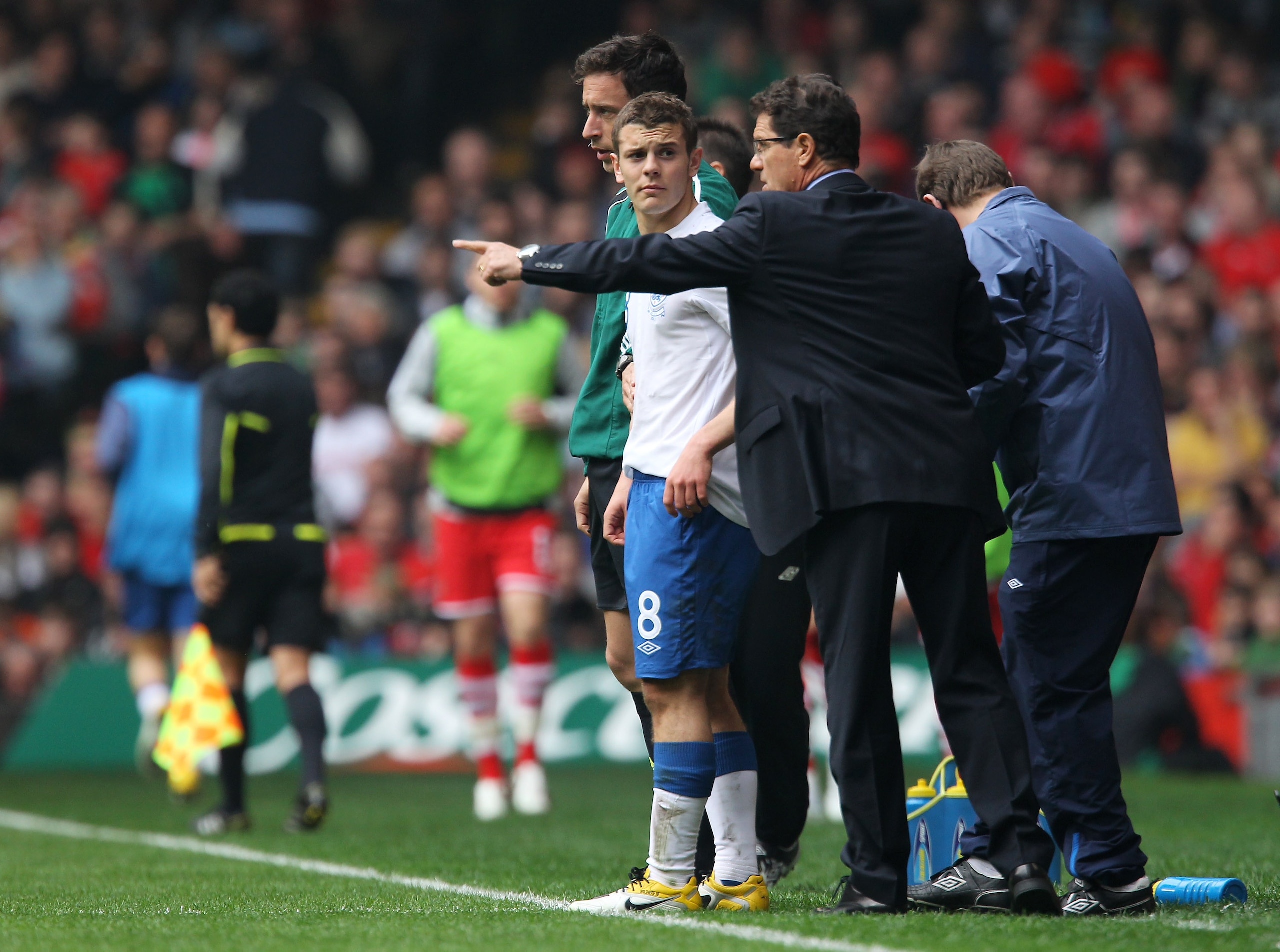 CARDIFF, WALES - MARCH 26:  England manager Fabio Capello gives instructions to Jack Wilshere during the UEFA EURO 2012 Group G qualifying match between Wales and England at the Millennium Stadium on March 26, 2011 in Cardiff, Wales.  (Photo by Alex Lives
