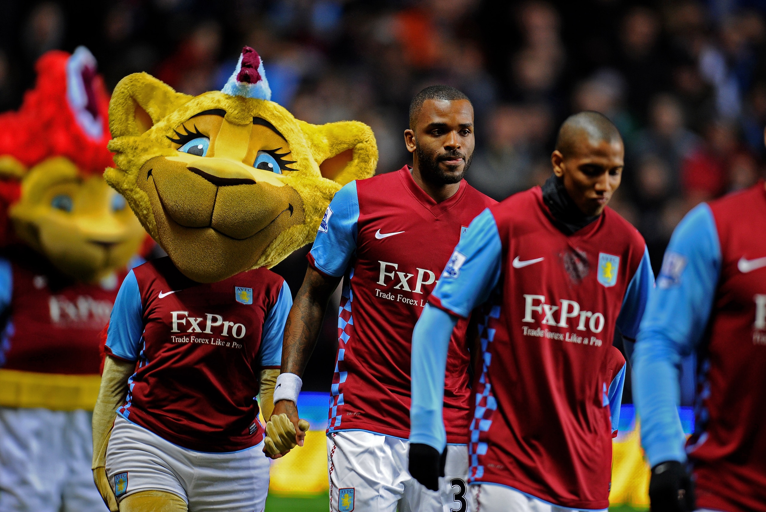 BIRMINGHAM, ENGLAND - JANUARY 22:  Darren Bent (C) of Aston Villa walks out onto the pitch to make his club debut during the Barclays Premier League match between Aston Villa and Manchester City at Villa Park on January 22, 2011 in Birmingham, England.  (