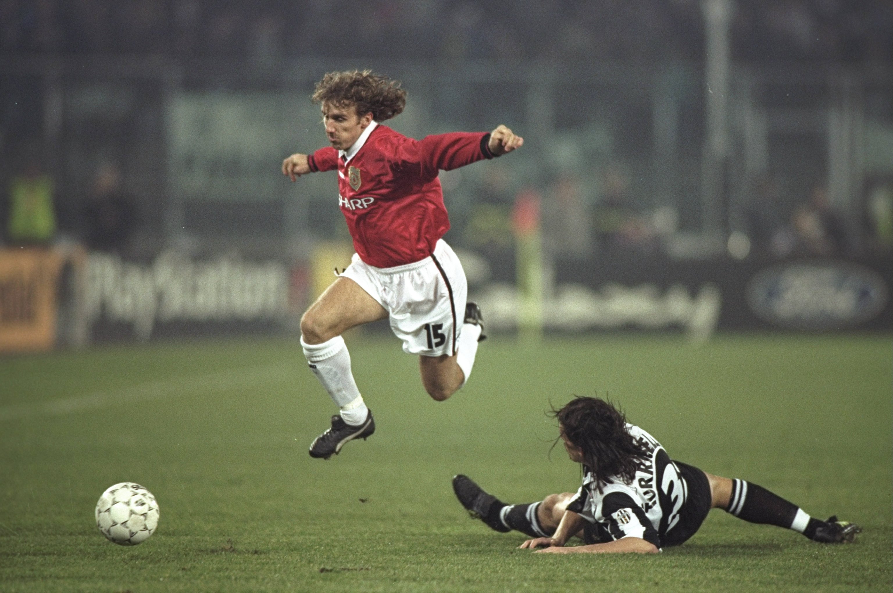 10 Dec 1997:  Karel Poborsky of Manchester United skips over the challenge of Moreno Torricelli of Juventus during the UEFA Champions League match at the Stadio Delle Alpi in Turin, Italy. Juventus won 1-0 to qualify for the quarter-finals. \ Mandatory Cr