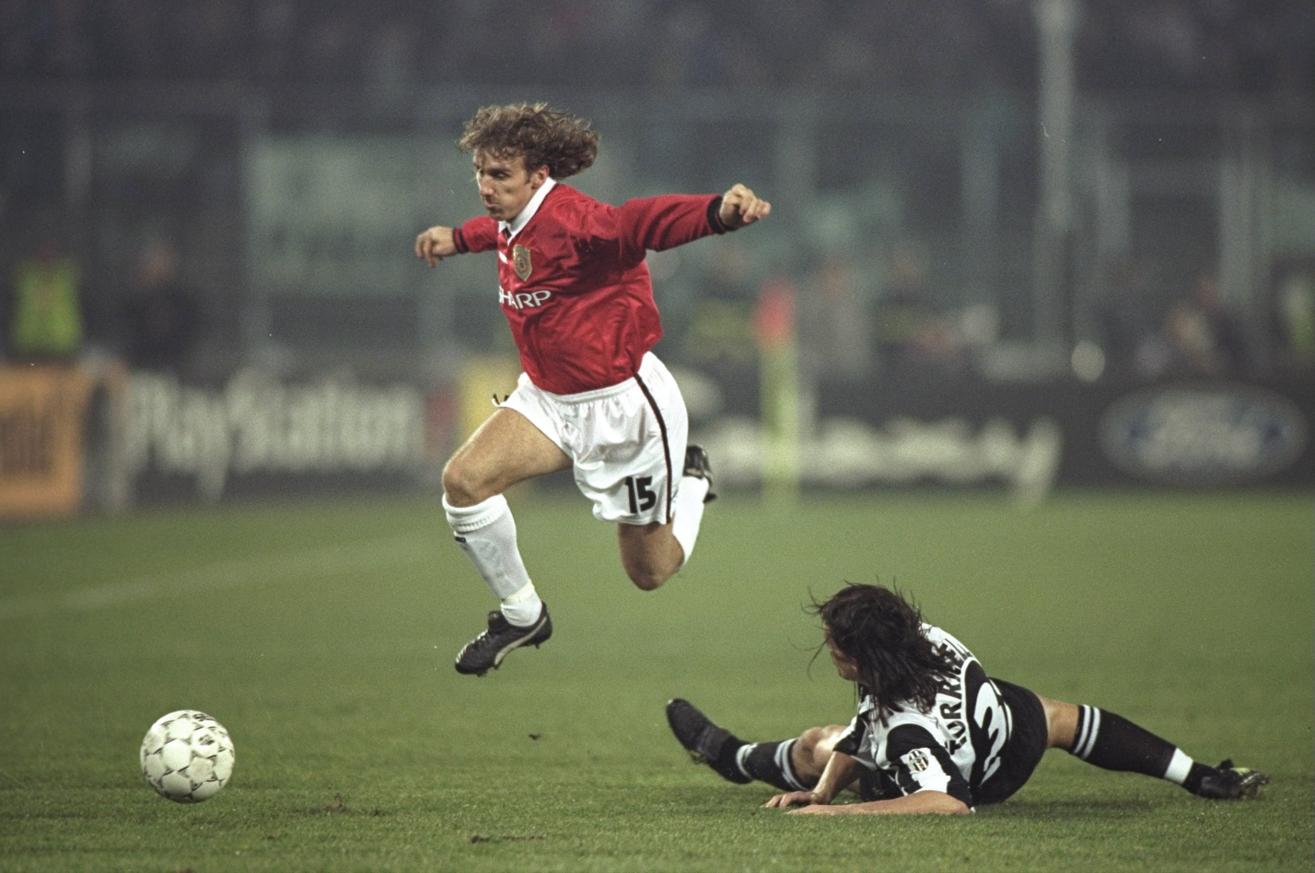 10 Dec 1997: Karel Poborsky of Manchester United skips over the challenge of Moreno Torricelli of Juventus during the UEFA Champions League match at the Stadio Delle Alpi in Turin, Italy. Juventus won 1-0 to qualify for the quarter-finals. \ Mandatory Cr 10 Dec 1997: Karel Poborsky of Manchester United skips over the challenge of Moreno Torricelli of Juventus during the UEFA Champions League match at the Stadio Delle Alpi in Turin, Italy. Juventus won 1-0 to qualify for the quarter-finals. \ Mandatory Cr