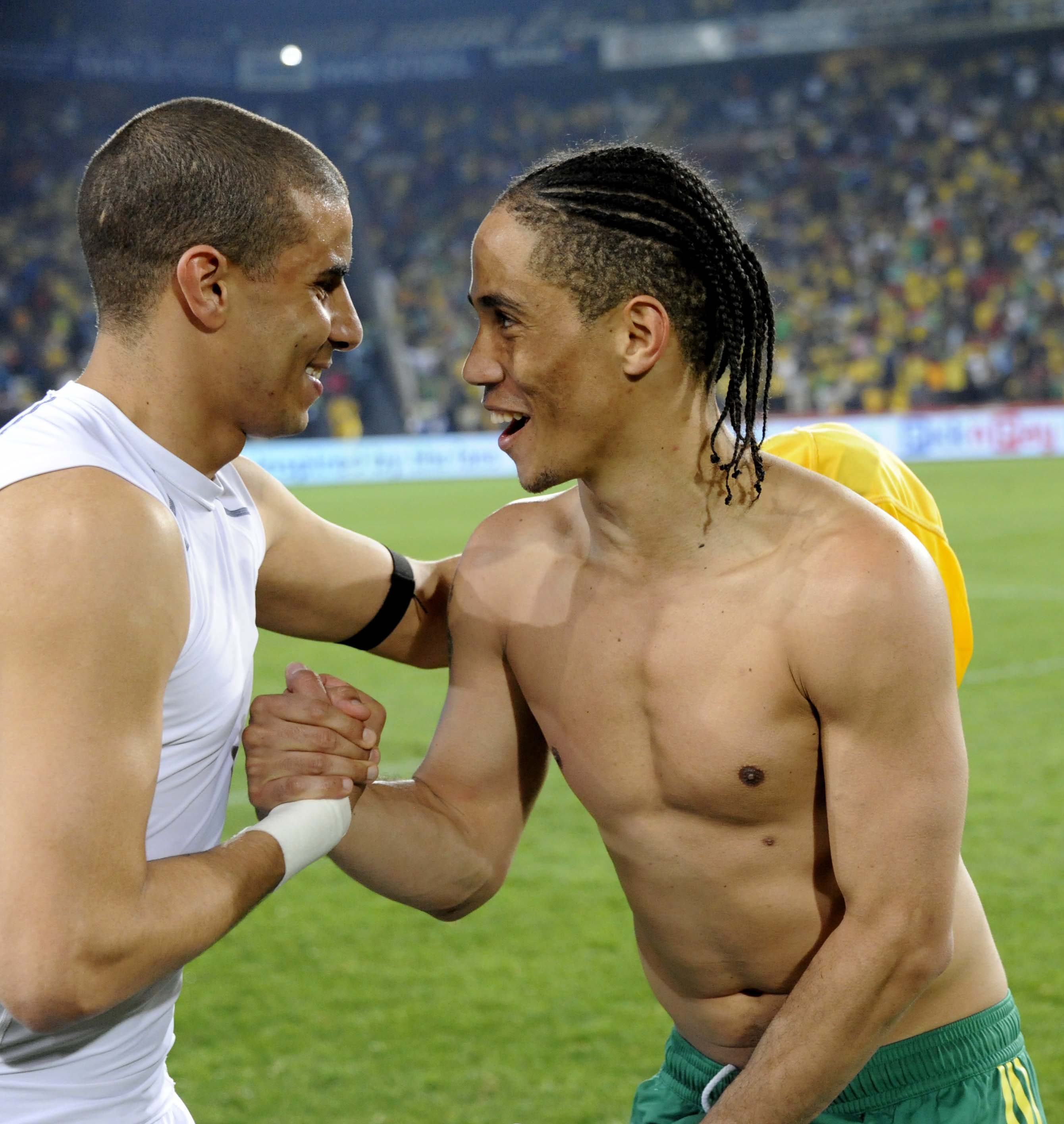 JOHANNESBURG, SOUTH AFRICA - MARCH 26:  Steven Pienaar (R) of South Africa greets Mohamed Zidan of Egypt during the 2012 Africa Cup of Nations Qualifier match between South Africa and Egypt at Coca Cola Park on March 26, 2011 in Johannesburg, South Africa