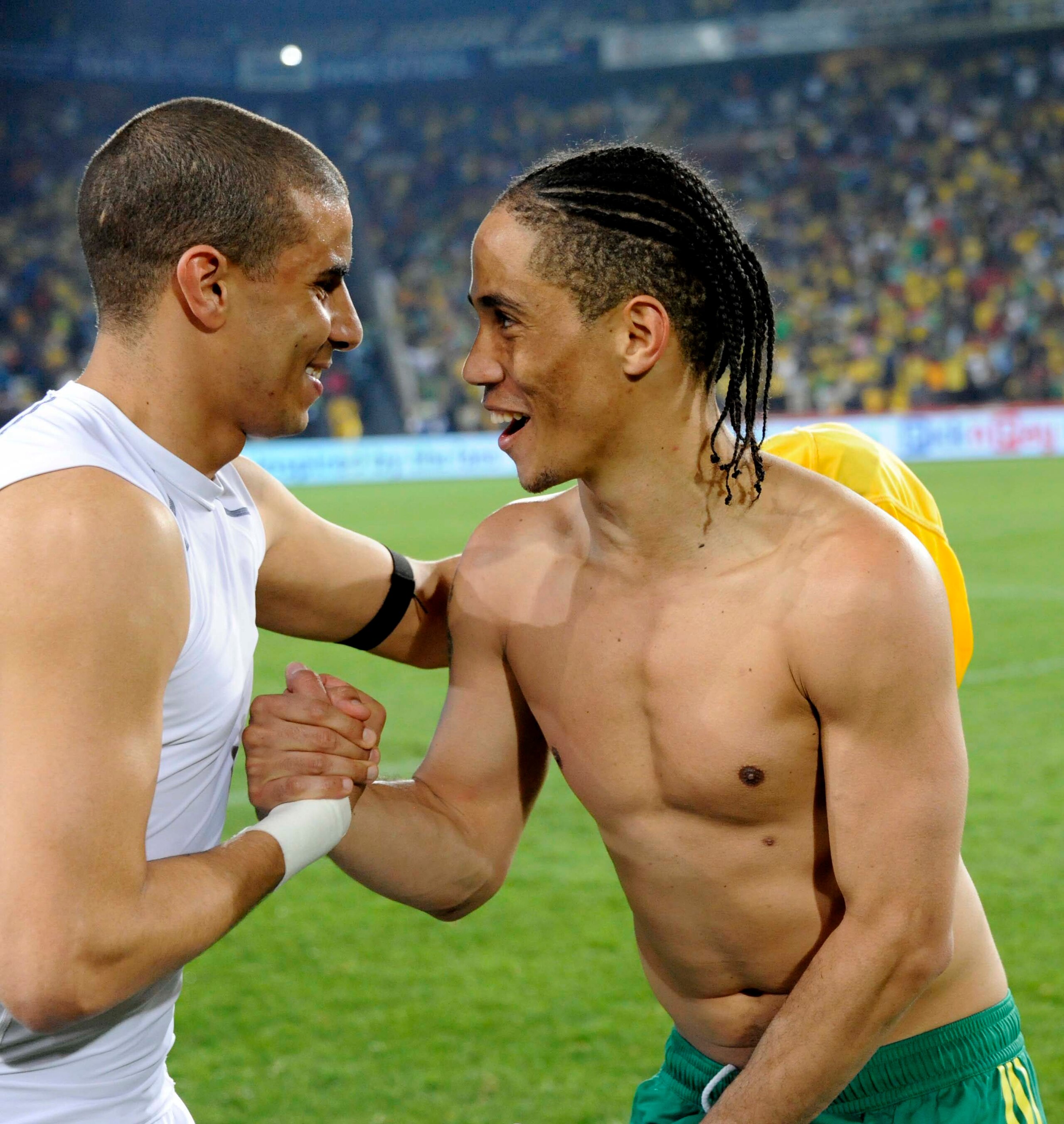 JOHANNESBURG, SOUTH AFRICA - MARCH 26:  Steven Pienaar (R) of South Africa greets Mohamed Zidan of Egypt during the 2012 Africa Cup of Nations Qualifier match between South Africa and Egypt at Coca Cola Park on March 26, 2011 in Johannesburg, South Africa