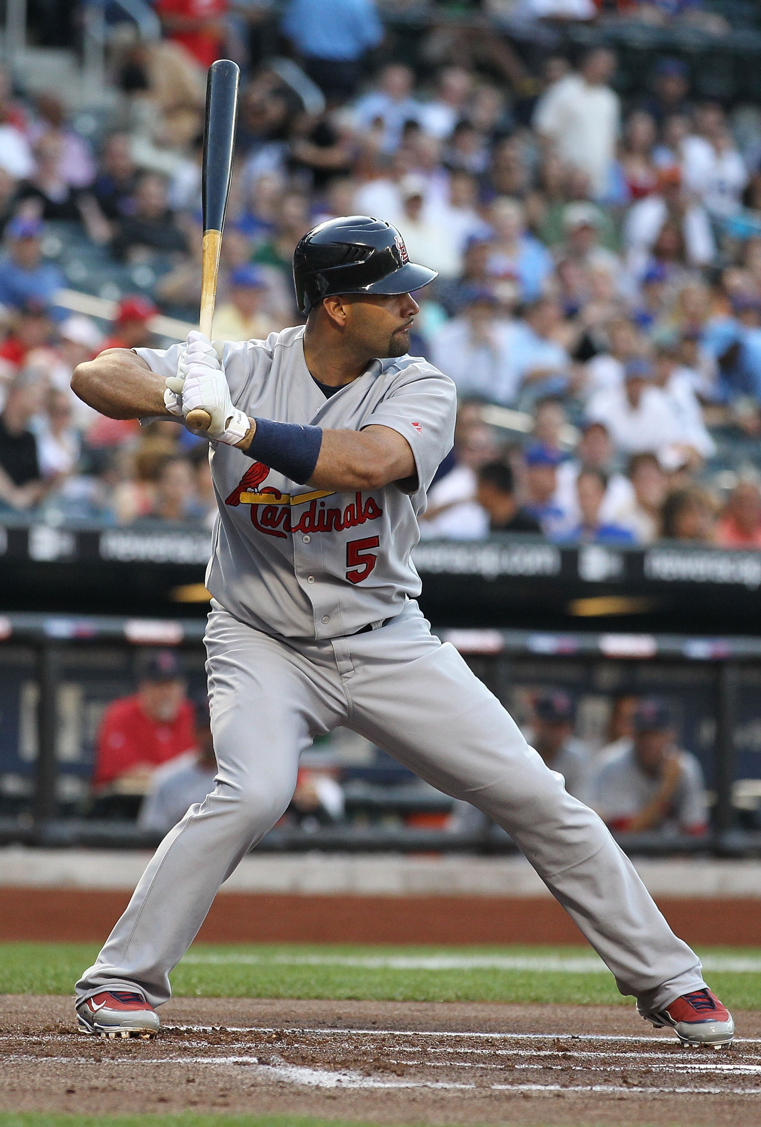 NEW YORK - JULY 27:  Albert Pujols #5 of the St. Louis Cardinals flies out against the New York Mets during their game on July 27, 2010 at Citi Field in the Flushing neighborhood of the Queens borough of New York City.  (Photo by Al Bello/Getty Images)