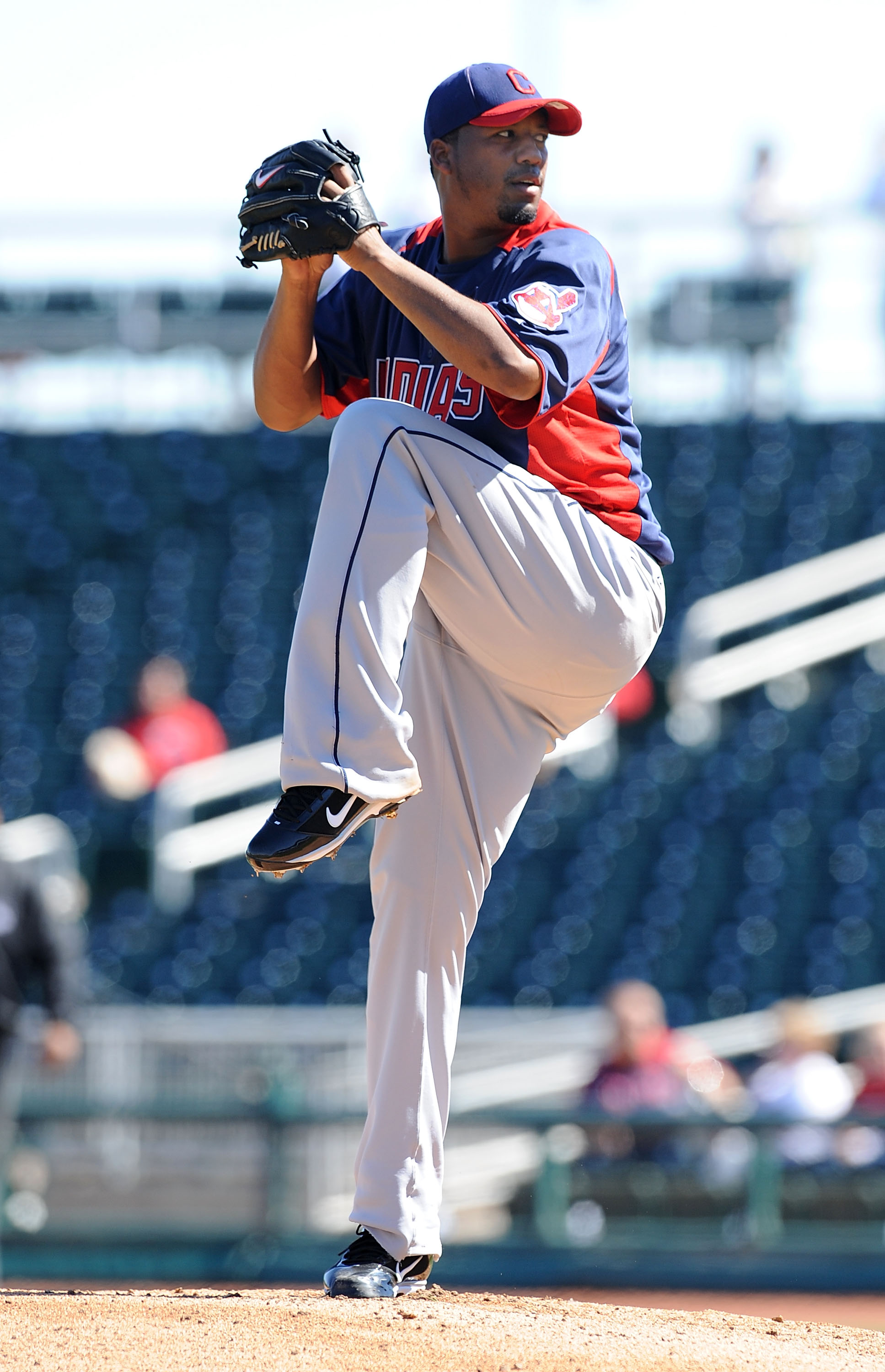 GOODYEAR, AZ - FEBRUARY 28:  Fausto Carmona #55 of the Cleveland Indians delivers a pitch during the first inning against the Cincinnati Reds at Goodyear Ballpark on February 28, 2011 in Goodyear, Arizona.  (Photo by Norm Hall/Getty Images)