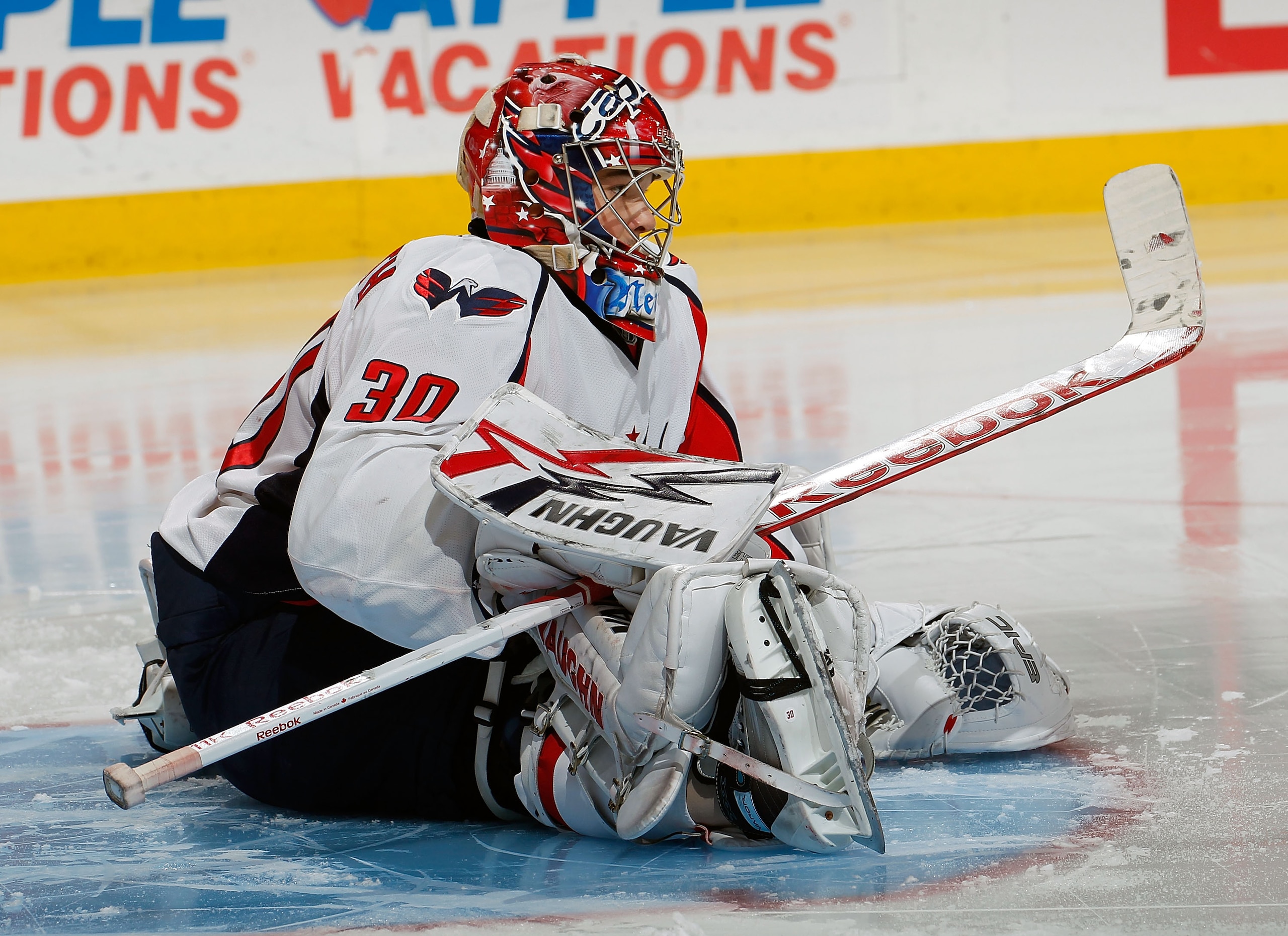 PHILADELPHIA, PA - MARCH 22:  Michal Neuvirth #30 of the Washington Capitals stretches during an NHL hockey game against the Philadelphia Flyers at the Wells Fargo Center on March 22, 2011 in Philadelphia, Pennsylvania.  (Photo by Paul Bereswill/Getty Ima