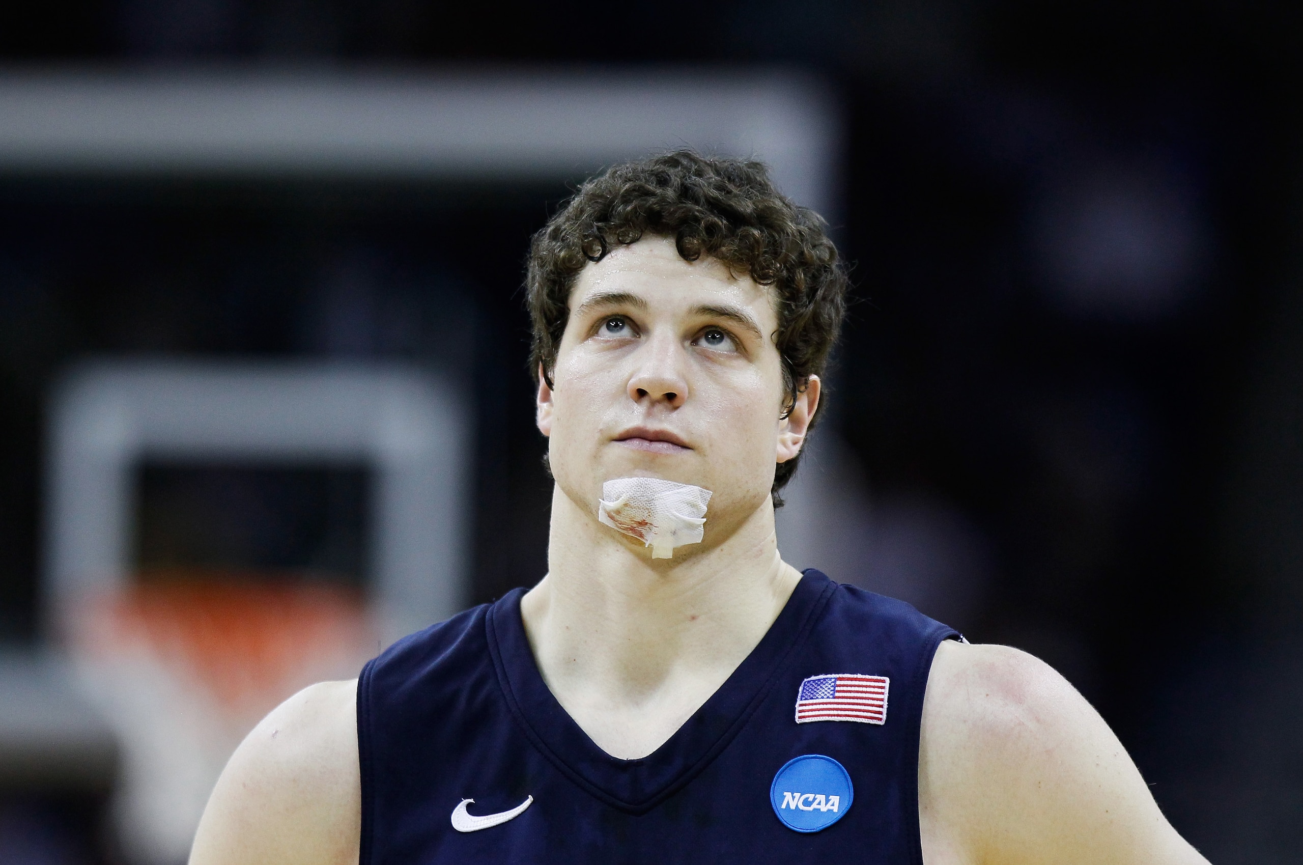 NEW ORLEANS, LA - MARCH 24: Jimmer Fredette #32 of the Brigham Young Cougars looks on with a bandage on his chin during the second half against the Florida Gators during the Southeast regional of the 2011 NCAA men's basketball tournament at New Orleans A NEW ORLEANS, LA - MARCH 24: Jimmer Fredette #32 of the Brigham Young Cougars looks on with a bandage on his chin during the second half against the Florida Gators during the Southeast regional of the 2011 NCAA men's basketball tournament at New Orleans A