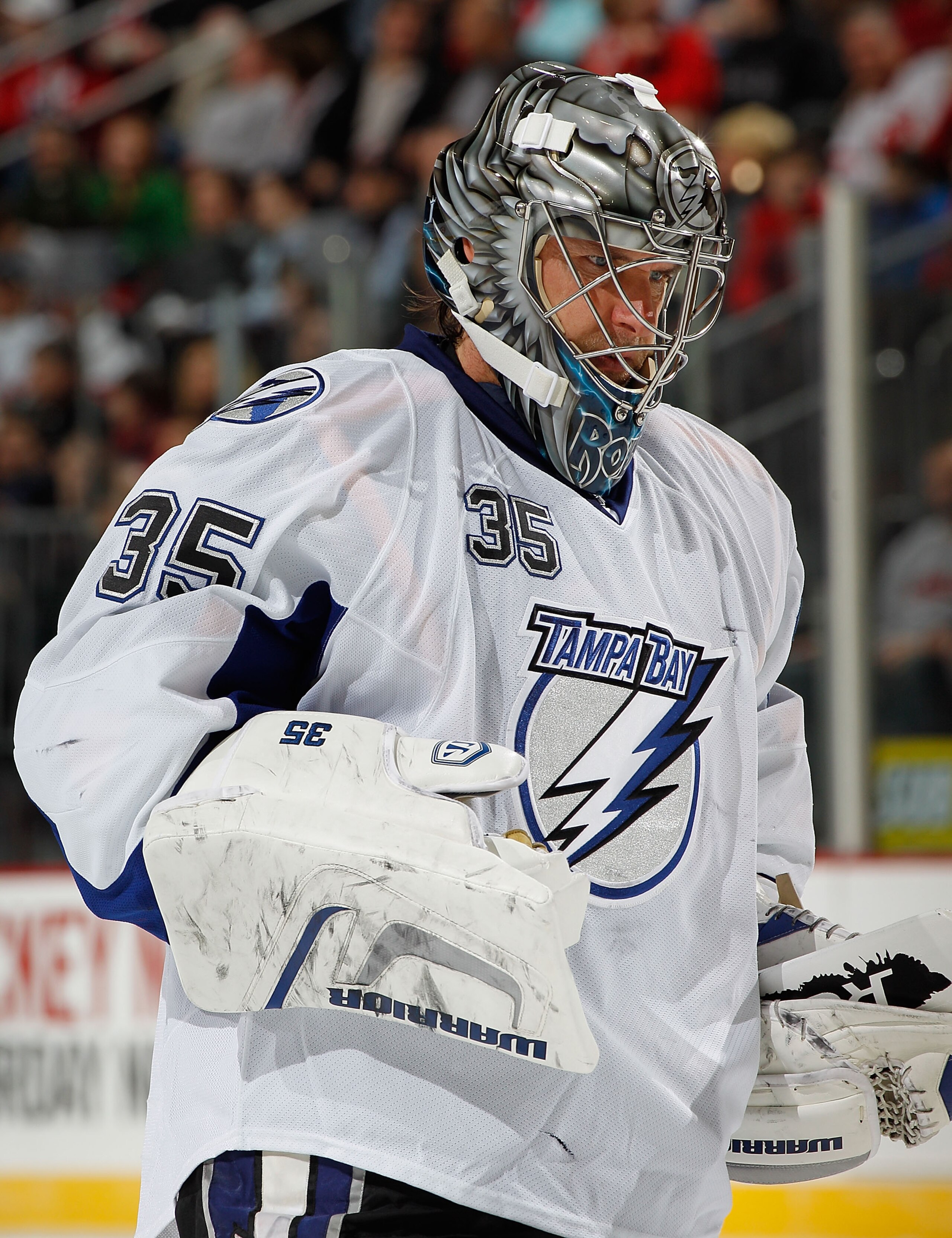 NEWARK, NJ - MARCH 02:  Goalie Dwayne Roloson #35 of the Tampa Bay Lightning relaxes during a timeout in an NHL hockey game against the New Jersey Devils at the Prudential Center on March 2, 2011 in Newark, New Jersey.  (Photo by Paul Bereswill/Getty Imag