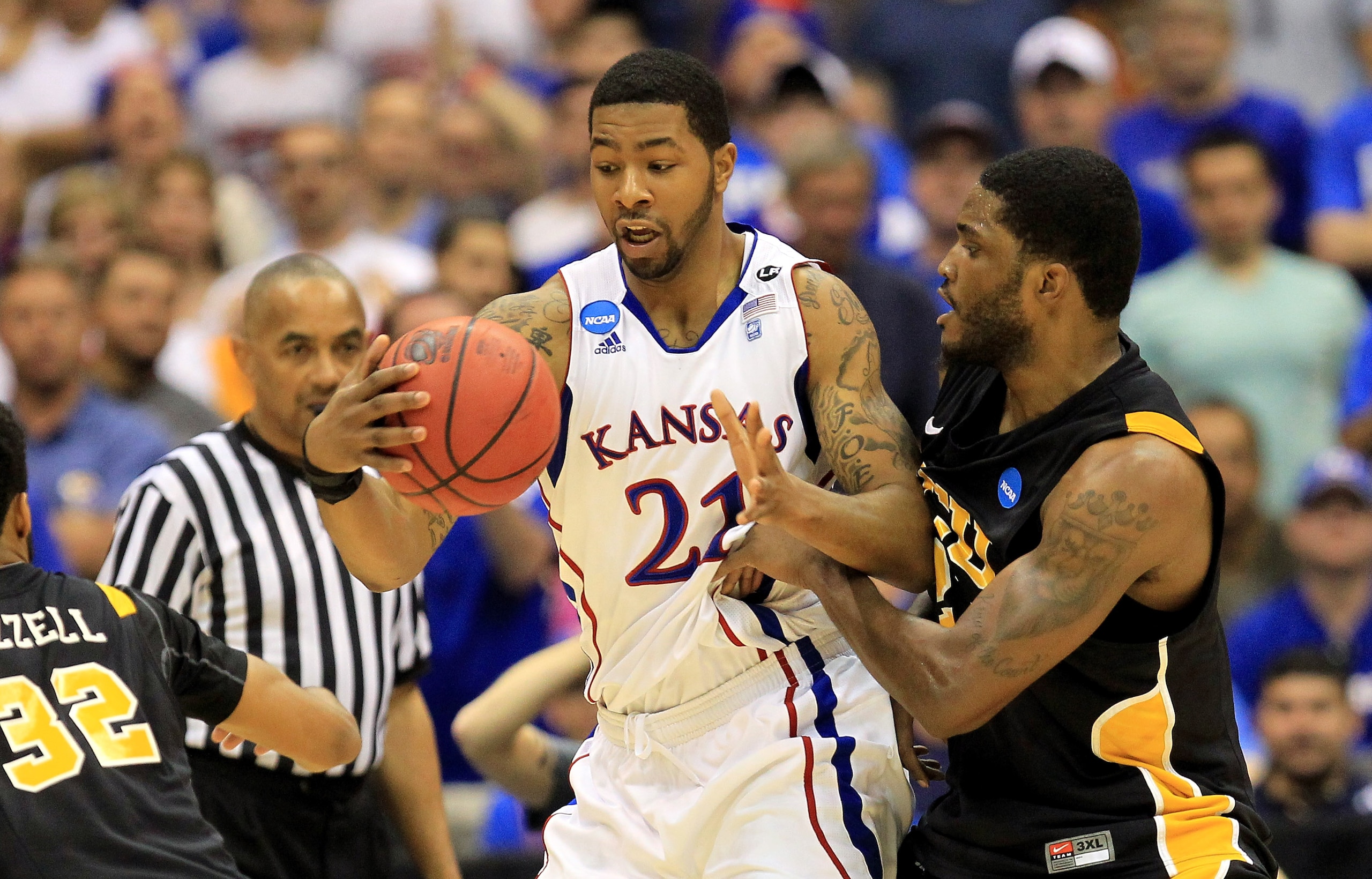 SAN ANTONIO, TX - MARCH 27: Markieff Morris #21 of the Kansas Jayhawks handles the ball against Jamie Skeen #21 of the Virginia Commonwealth Rams during the southwest regional final of the 2011 NCAA men's basketball tournament at the Alamodome on March 2 SAN ANTONIO, TX - MARCH 27: Markieff Morris #21 of the Kansas Jayhawks handles the ball against Jamie Skeen #21 of the Virginia Commonwealth Rams during the southwest regional final of the 2011 NCAA men's basketball tournament at the Alamodome on March 2