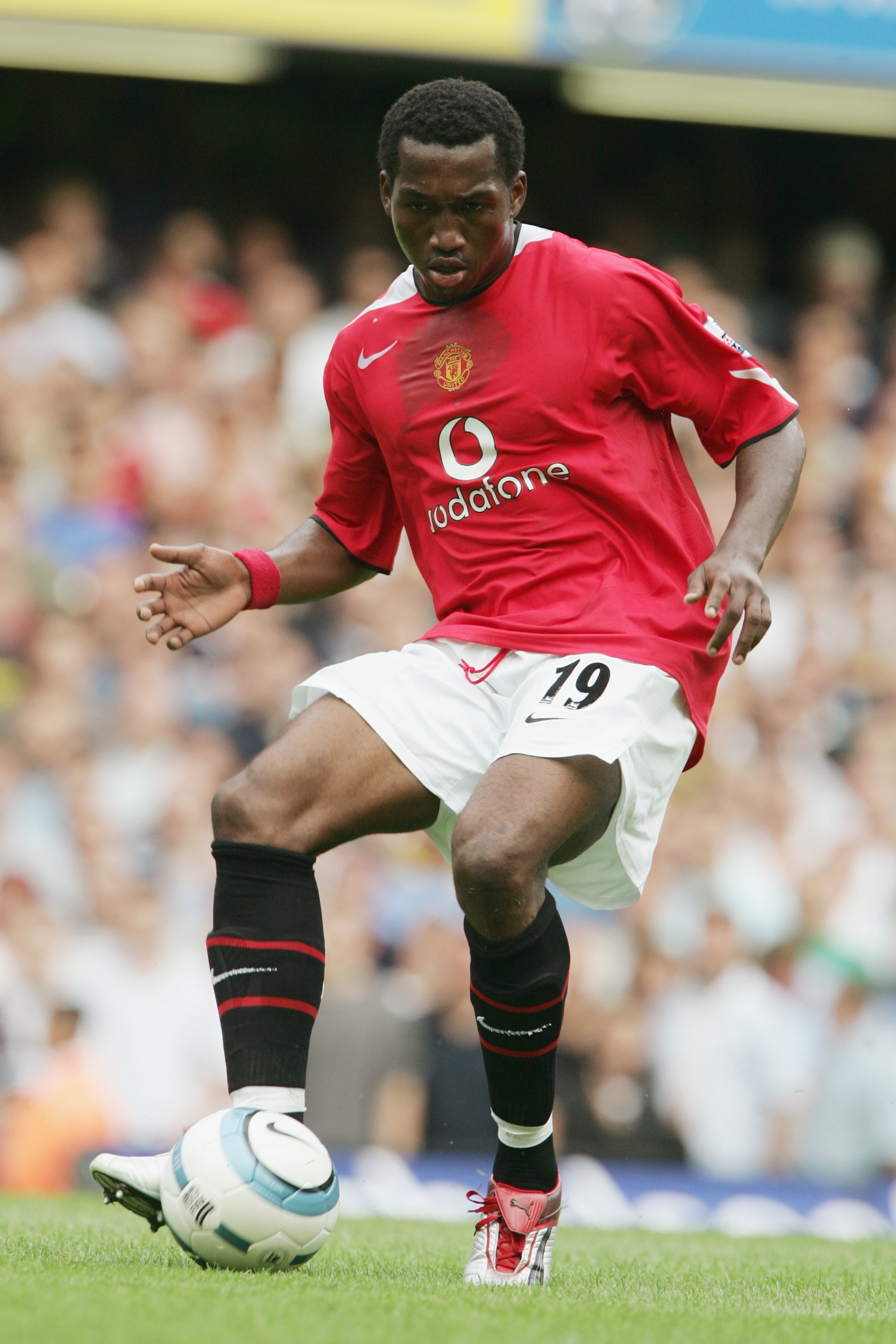 LONDON - AUGUST 15: Eric Djemba-Djemba of Manchester United in action during the Barclays Premiership match between Chelsea and Manchester United at Stamford Bridge on August 15, 2004 in London. (Photo by Phil Cole/Getty Images) LONDON - AUGUST 15: Eric Djemba-Djemba of Manchester United in action during the Barclays Premiership match between Chelsea and Manchester United at Stamford Bridge on August 15, 2004 in London. (Photo by Phil Cole/Getty Images)