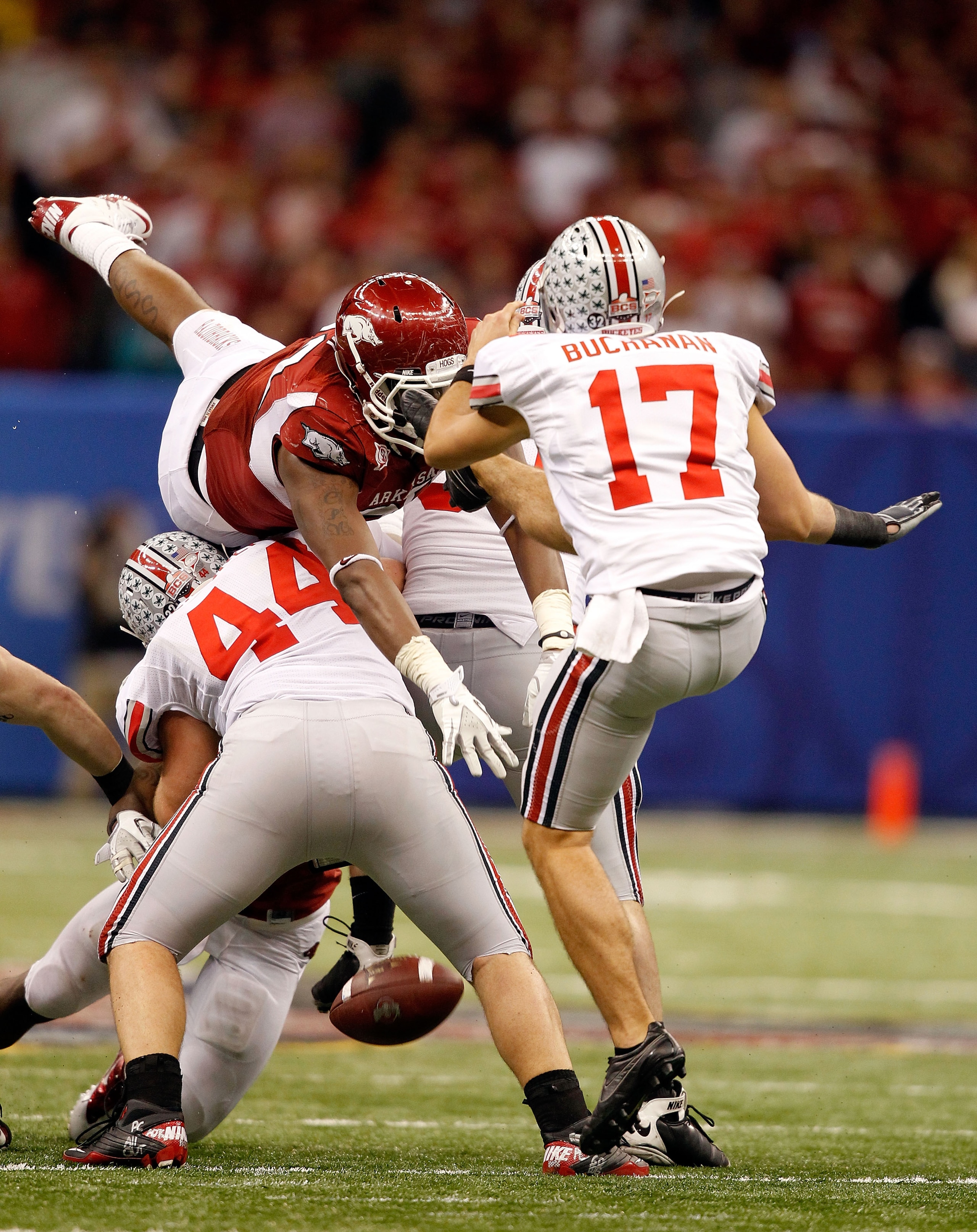 NEW ORLEANS, LA - JANUARY 04:  Chris Gragg #80 of the Arkansas Razorbacks blocks a punt by Ben Buchanan #17 of the Ohio State Buckeyes in the fourth quarter during the Allstate Sugar Bowl at the Louisiana Superdome on January 4, 2011 in New Orleans, Louis