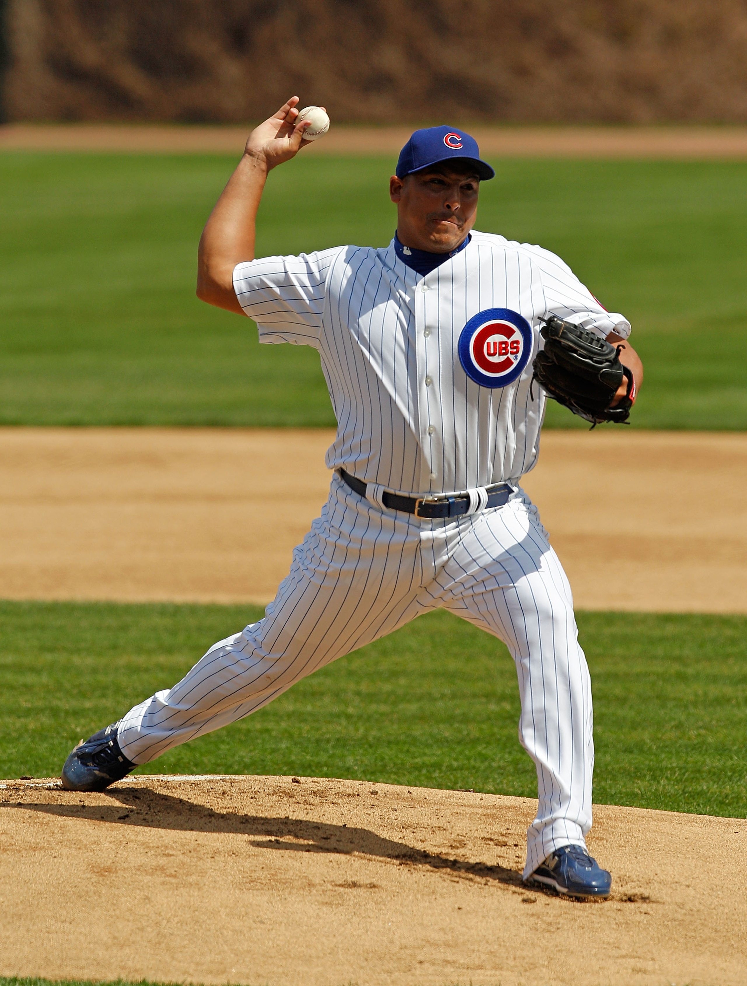 CHICAGO - APRIL 15: Starting pitcher Carlos Zambrano of the Chicago Cubs, wearing a number 42 jersey in honor of Jackie Robinson, delivers the ball against the Milwaukee Brewers at Wrigley Field on April 15, 2010 in Chicago, Illinois. (Photo by Jonathan D