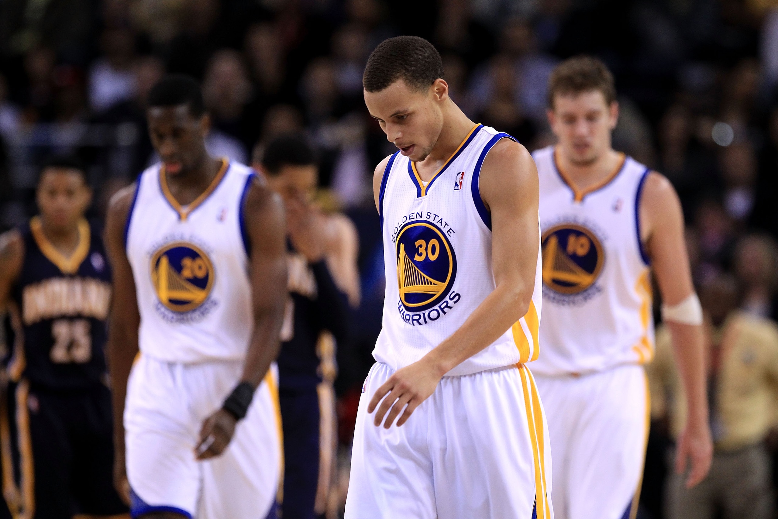 OAKLAND, CA - JANUARY 19:  Stephen Curry #30 of the Golden State Warriors walks back down the court after the Warriors were called for a offensive foul during their game against the Indiana Pacers at Oracle Arena on January 19, 2011 in Oakland, California