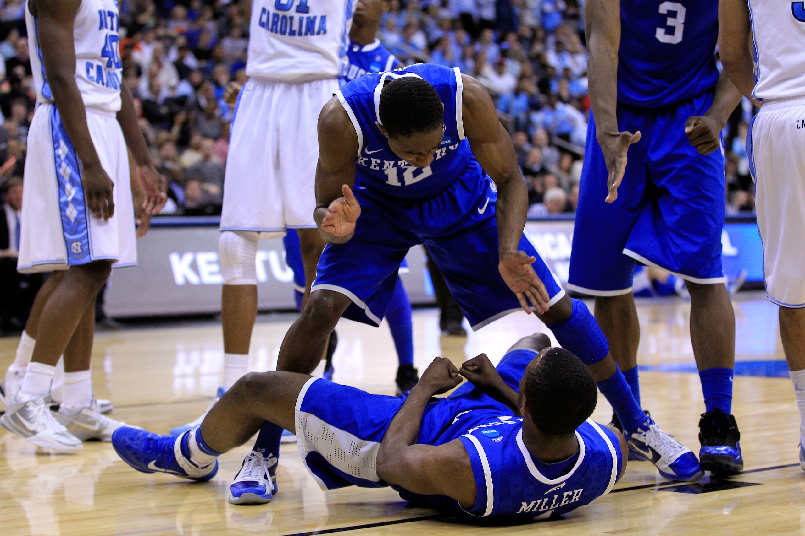 NEWARK, NJ - MARCH 27:  Brandon Knight #12 of the Kentucky Wildcats stands over Darius Miller #1 after a point against the North Carolina Tar Heels during the second half of the east regional final of the 2011 NCAA men's basketball tournament at Prudentia