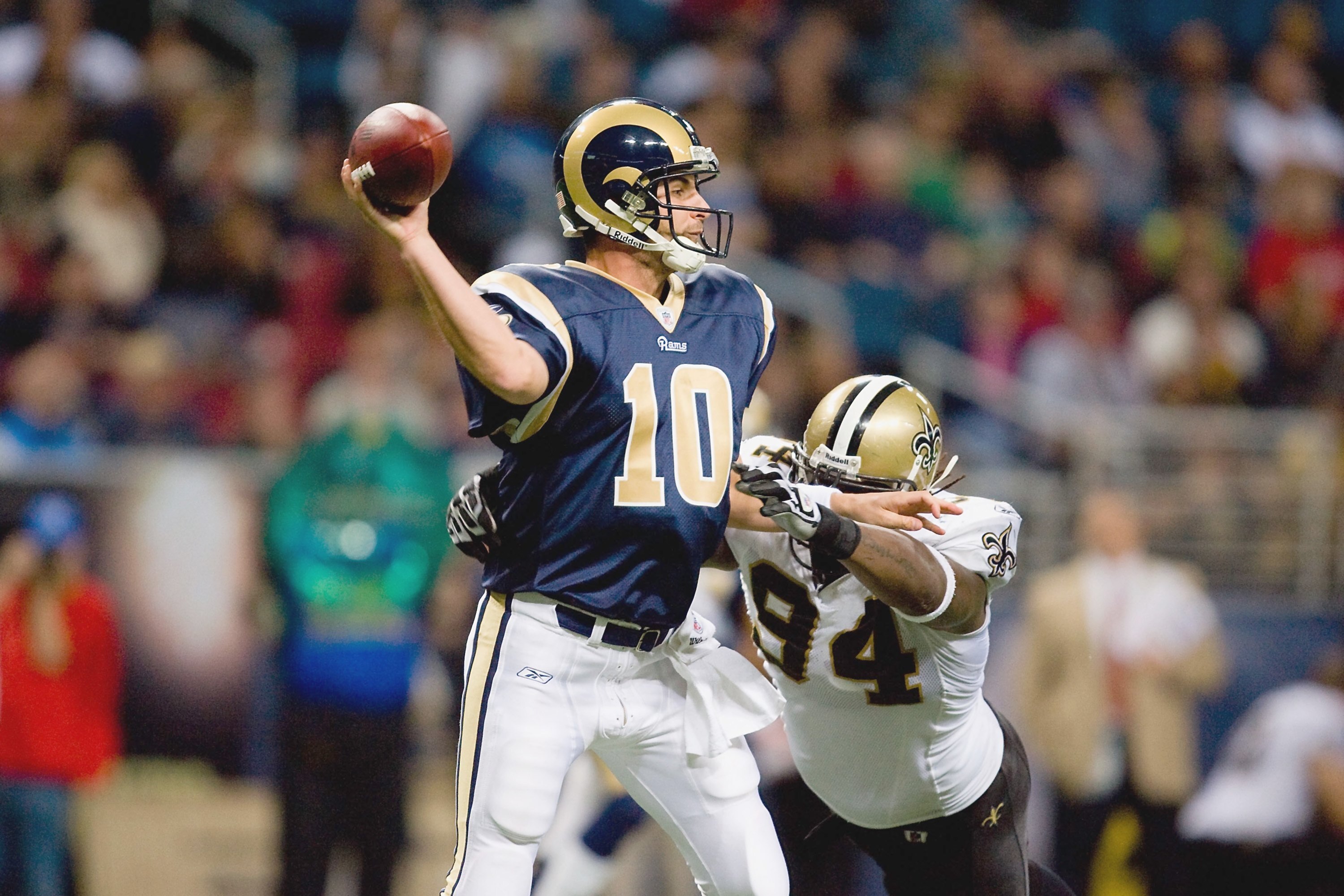 ST. LOUIS - NOVEMBER 15:  Quarterback Marc Bulger #10 of the St. Louis Rams looks to pass the ball against Charles Grant #94 of the New Orleans Saints at the Edward Jones Dome on November 15, 2009 in St. Louis, Missouri.  (Photo by Dilip Vishwanat/Getty I