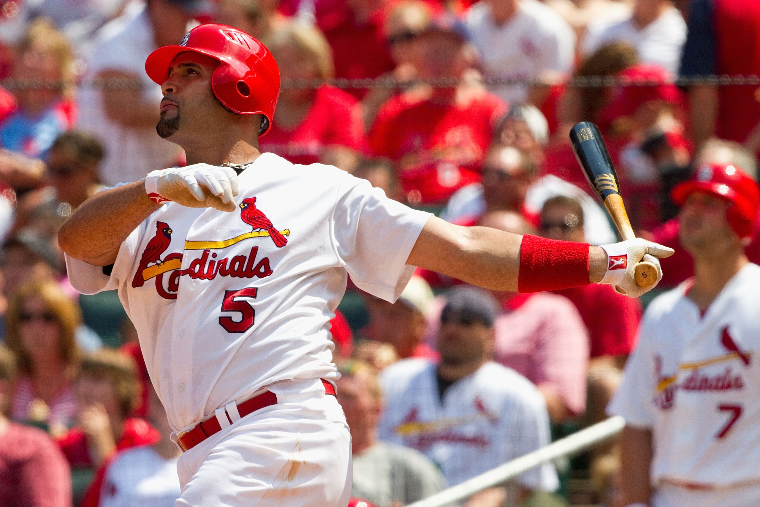 ST. LOUIS - AUGUST 1: Albert Pujols #5 of the St. Louis Cardinals hits a two-run home run against the Pittsburgh Pirates at Busch Stadium on August 1, 2010 in St. Louis, Missouri.  The Cardinals beat the Pirates 9-1.  (Photo by Dilip Vishwanat/Getty Image