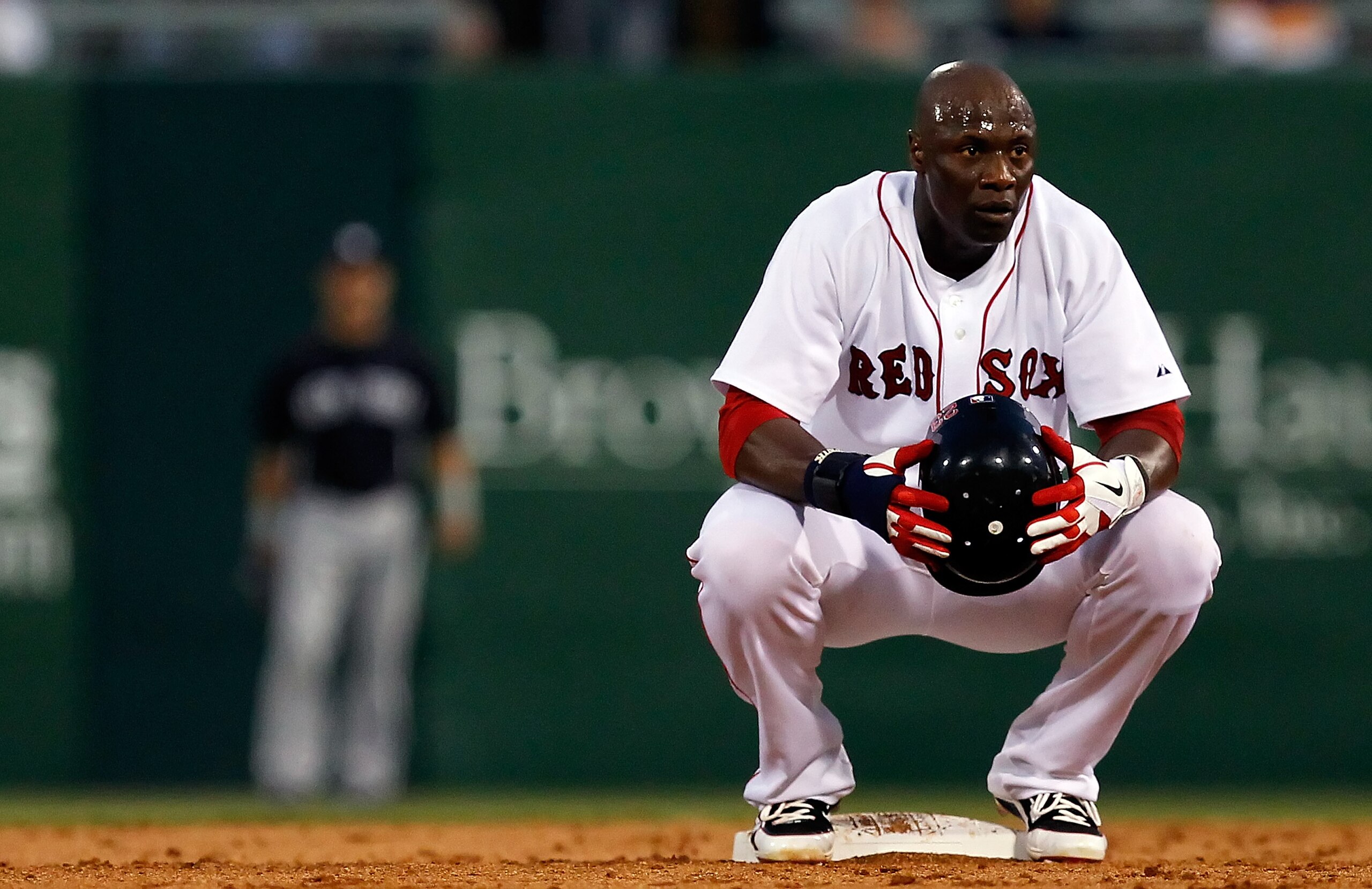 FORT MYERS, FL - MARCH 14:  Outfielder Mike Cameron #23 of the Boston Red Sox waits at second base against the New York Yankees during a Grapefruit League Spring Training Game at City of Palms Park on March 14, 2011 in Fort Myers, Florida.  (Photo by J. M